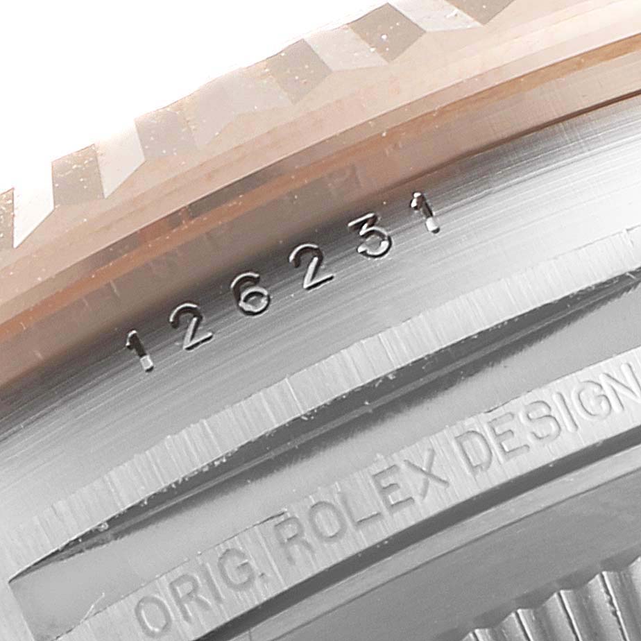 The image shows a close-up angle of the model and design number on the case of a Rolex Datejust 126231 Men
s Steel and Gold (two tone) Grey Dial 126231 Men
s Steel and Gold (two tone) Grey Dial watch.