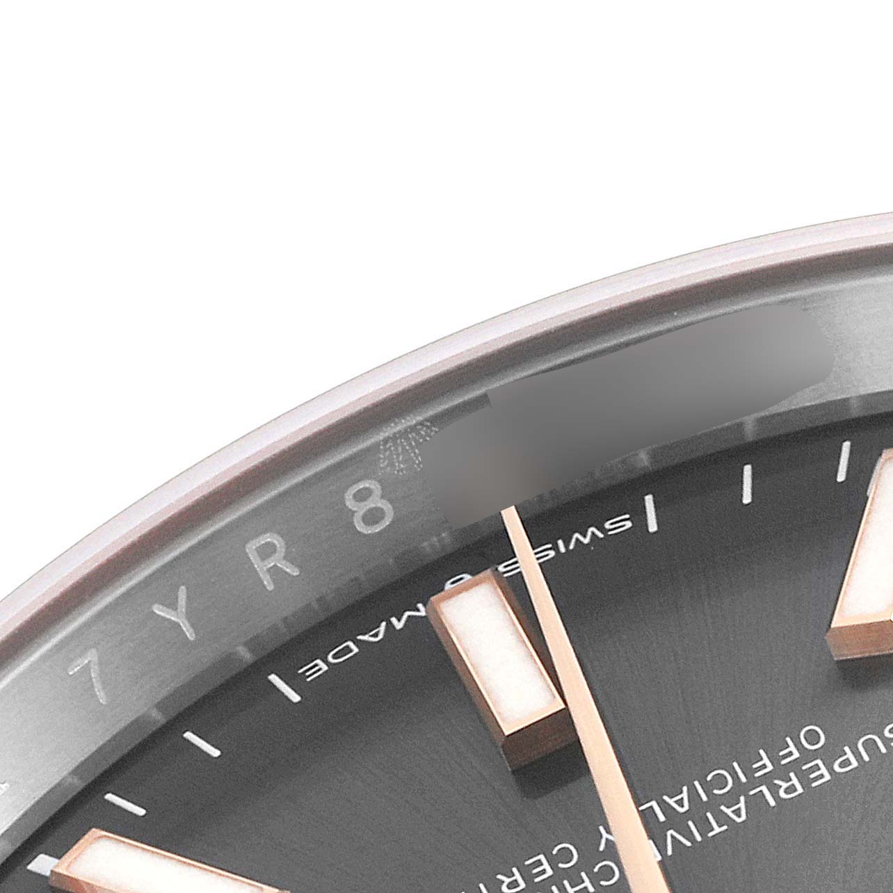 The image shows a close-up of the dial and part of the bezel of a Rolex Datejust 126231 Men
s Steel and Gold (two tone) Grey Dial 126231 Men
s Steel and Gold (two tone) Grey Dial watch, highlighting the hour markers and text.
