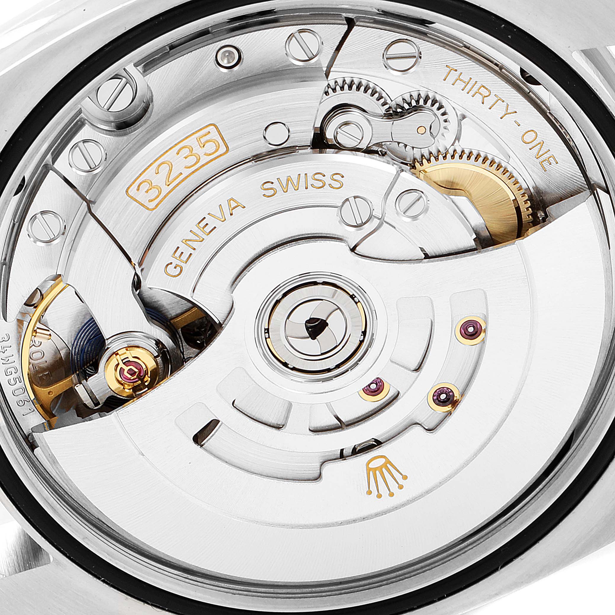 This image shows the movement mechanism of a Rolex Datejust 126231 Men's Steel and Gold (two tone) White Dial 126231 Men's Steel and Gold (two tone) White Dial watch from a close-up, rear angle.