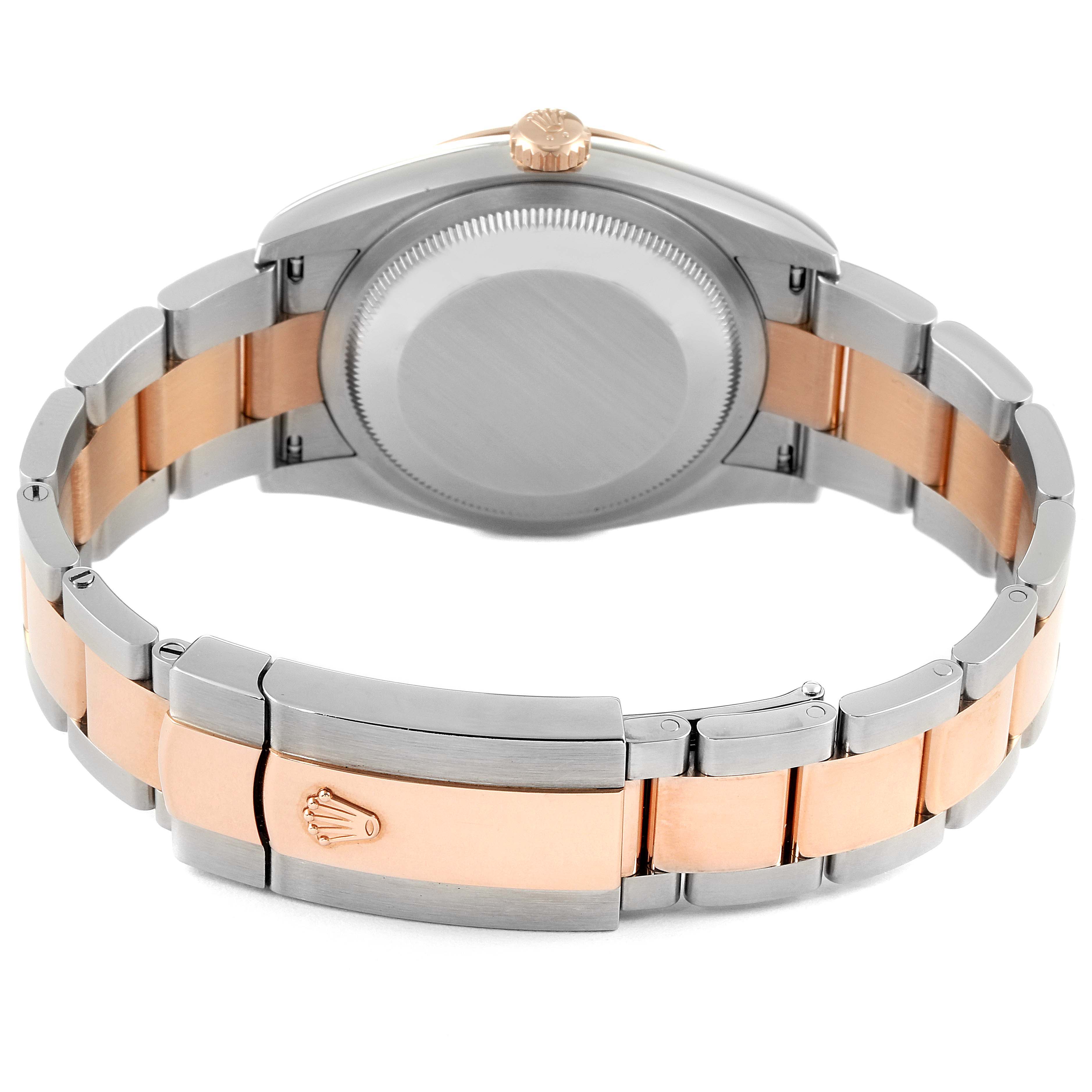 This image shows the back view of a Rolex Datejust 126231 Men's Steel and Gold (two tone) White Dial 126231 Men's Steel and Gold (two tone) White Dial watch with a two-tone metal bracelet and a closed clasp.