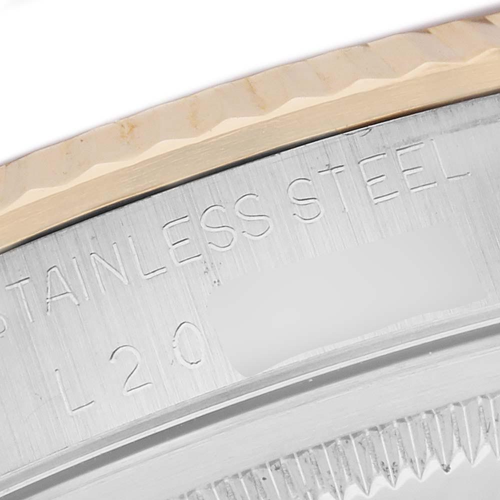 The image shows the side of the Rolex Datejust 16233 Men's Steel and Gold (two tone) Champagne Dial 16233 Men's Steel and Gold (two tone) Champagne Dial watch, highlighting the stainless steel case with engraved text.