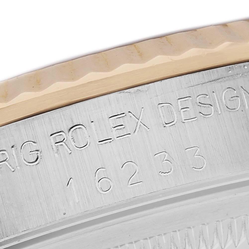 The image shows the side profile of a Rolex Datejust 16233 Men's Steel and Gold (two tone) Champagne Dial 16233 Men's Steel and Gold (two tone) Champagne Dial, highlighting the engraved model number and the bezel's edge.