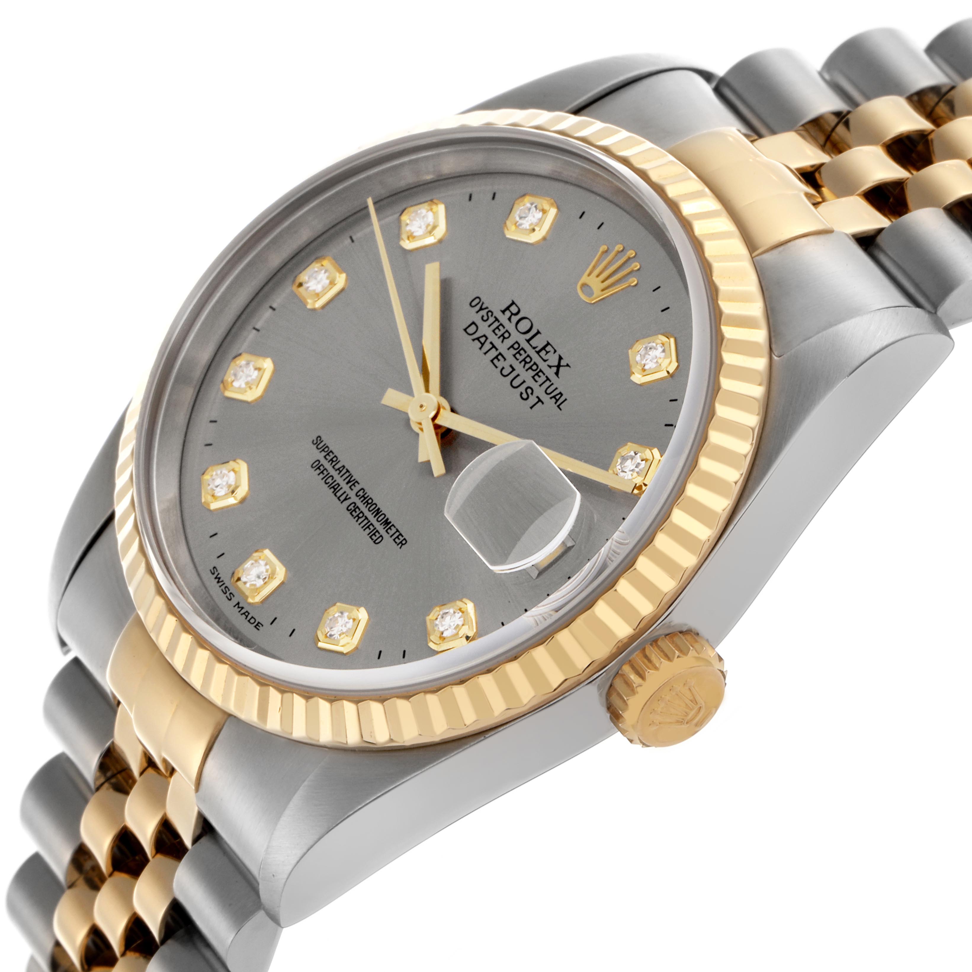 The Rolex Datejust 16233 Men's Steel and Gold (two tone) Silver Dial 16233 Men's Steel and Gold (two tone) Silver Dial is shown at a tilted angle, highlighting its gray dial, gold bezel, diamond markers, and bicolor bracelet.