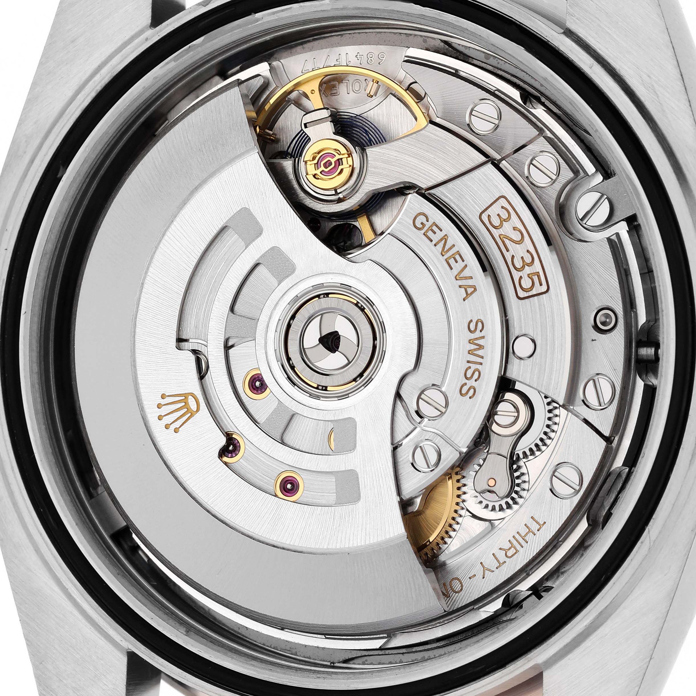 This is a close-up view of the movement mechanism inside a Rolex Datejust 41 126301 Men's Steel and Gold (two tone) Grey Dial 126301 Men's Steel and Gold (two tone) Grey Dial watch.