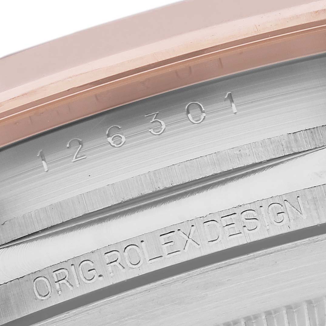 The image shows a close-up of the serial number and engraving on the case of a Rolex Datejust 41 126301 Men's Steel and Gold (two tone) Grey Dial 126301 Men's Steel and Gold (two tone) Grey Dial watch.