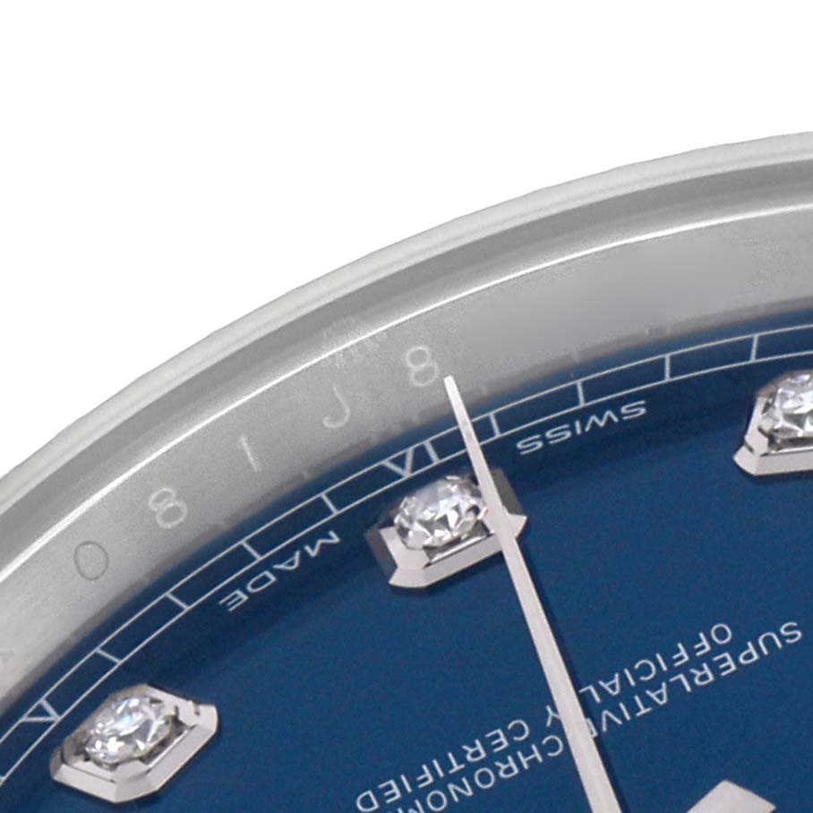 The image shows a close-up of the Rolex Datejust 41 126334 Men
s Stainless Steel Blue Dial 126334 Men
s Stainless Steel Blue Dial watch face, highlighting the dial, diamond hour markers, and part of the bezel.