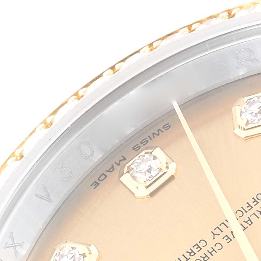 The image shows a close-up of the Rolex Datejust 116243 Men's Steel and Gold (two tone) Champagne Dial 116243 Men's Steel and Gold (two tone) Champagne Dial dial, featuring diamond hour markers and part of the bezel.