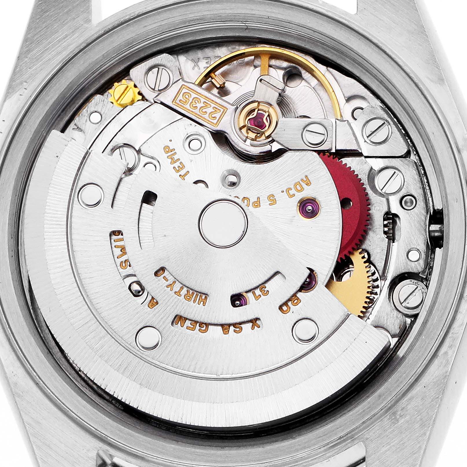 The image shows the movement of a Rolex Datejust 79173 Women's Steel and Gold (two tone) Mother of Pearl Dial 79173 Women's Steel and Gold (two tone) Mother of Pearl Dial watch from a top-down angle, highlighting gears and mechanical parts.