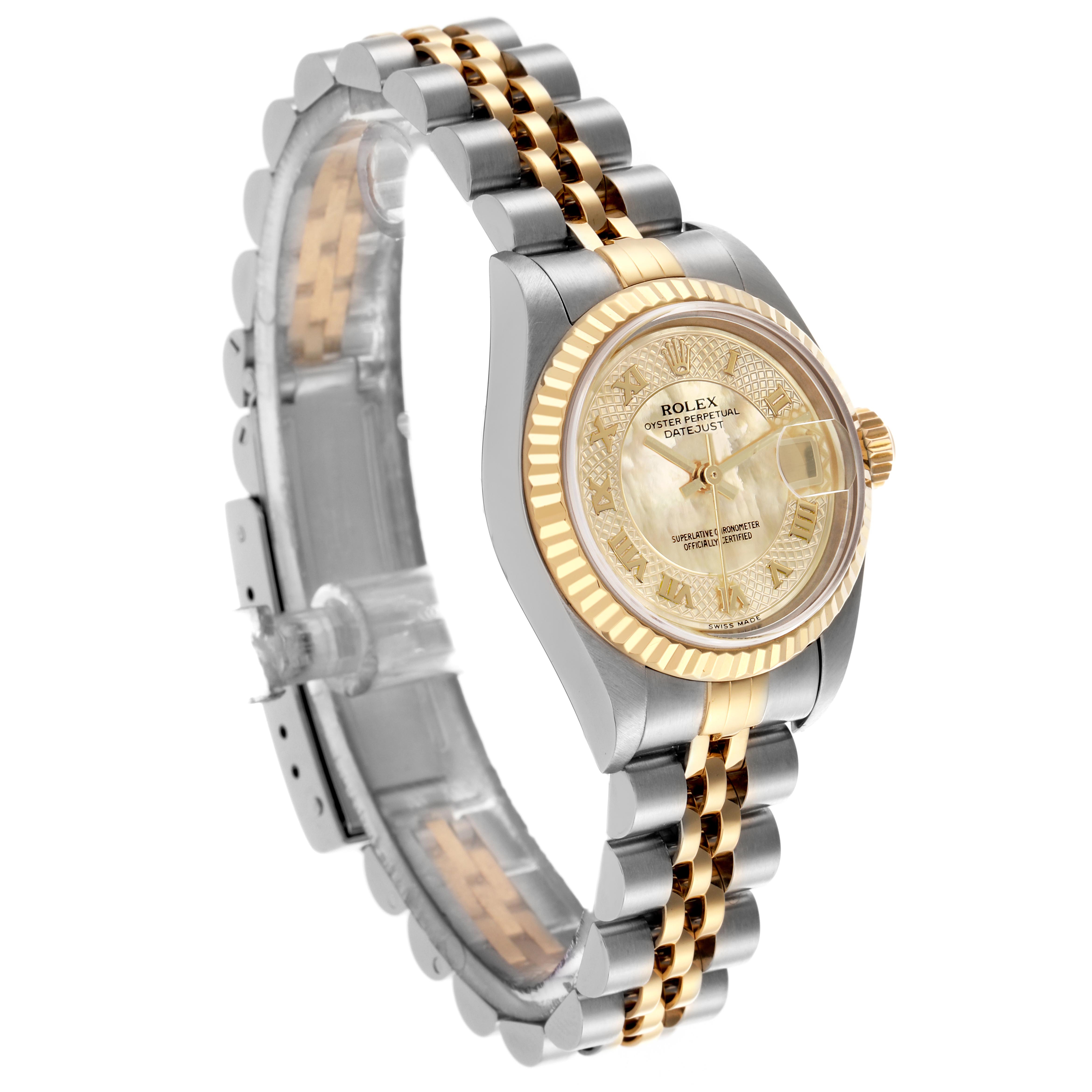 The Rolex Datejust 79173 Women's Steel and Gold (two tone) Mother of Pearl Dial 79173 Women's Steel and Gold (two tone) Mother of Pearl Dial is shown from a side angle featuring its gold dial, fluted bezel, and two-tone bracelet.