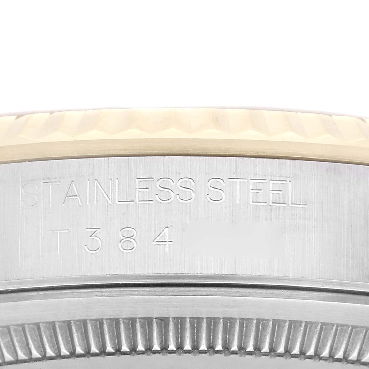 The image shows a close-up of the bezel and case side of a Rolex Datejust 16233 Men's Steel and Gold (two tone) Champagne Dial 16233 Men's Steel and Gold (two tone) Champagne Dial, displaying the "STAINLESS STEEL" engraving.