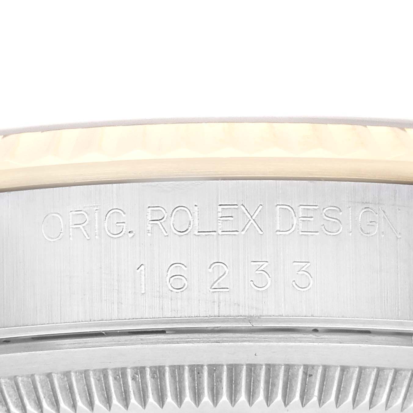 The image shows a close-up of the side case of a Rolex Datejust 16233 Men's Steel and Gold (two tone) Champagne Dial 16233 Men's Steel and Gold (two tone) Champagne Dial, displaying the serial number and "ORIG. ROLEX DESIGN."