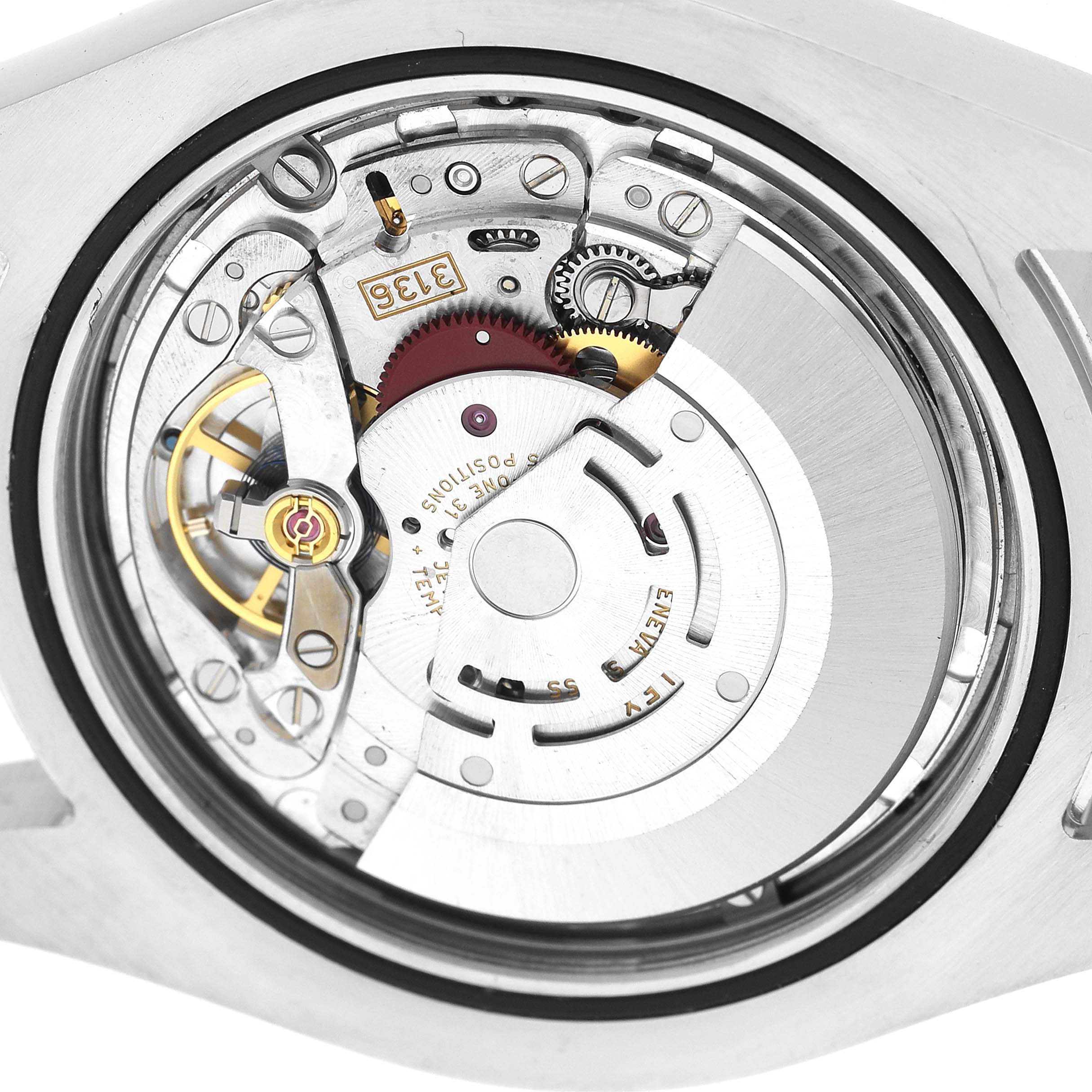 The image shows the open case back view of a Rolex Datejust 41 116300 Men's Stainless Steel Black Dial, highlighting its intricate movement components.