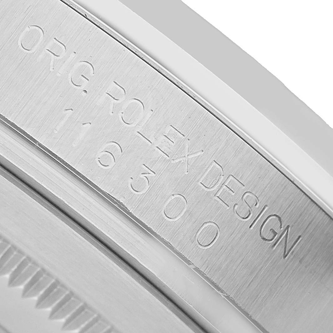 The image shows a close-up of the Rolex Datejust 41 116300 Men's Stainless Steel Black Dial's inner bezel, featuring engraved text with the model number.