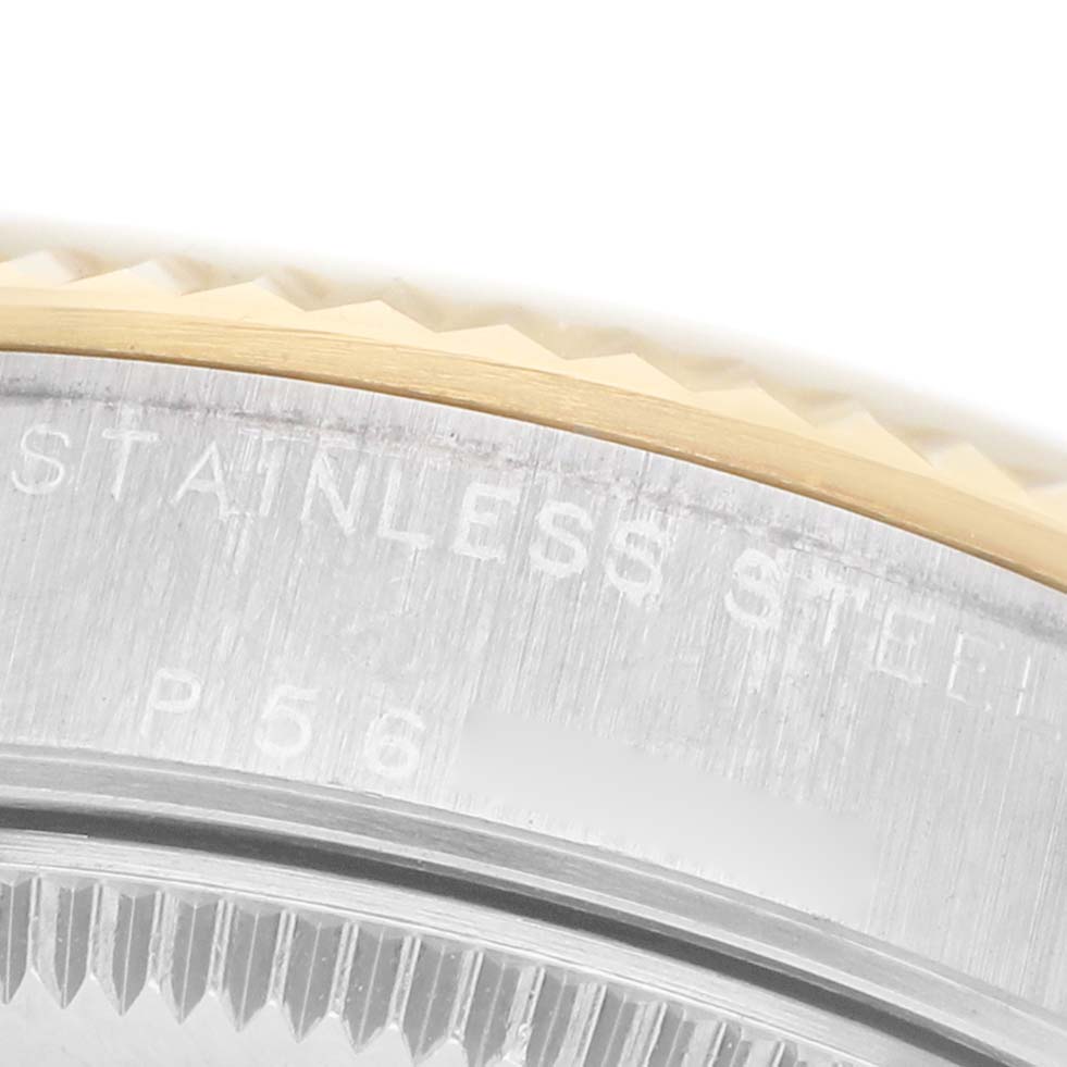 The image shows a close-up of the stainless steel case and fluted bezel of a Rolex Mid-Size 78273 Women's Steel and Gold (two tone) White Dial watch.