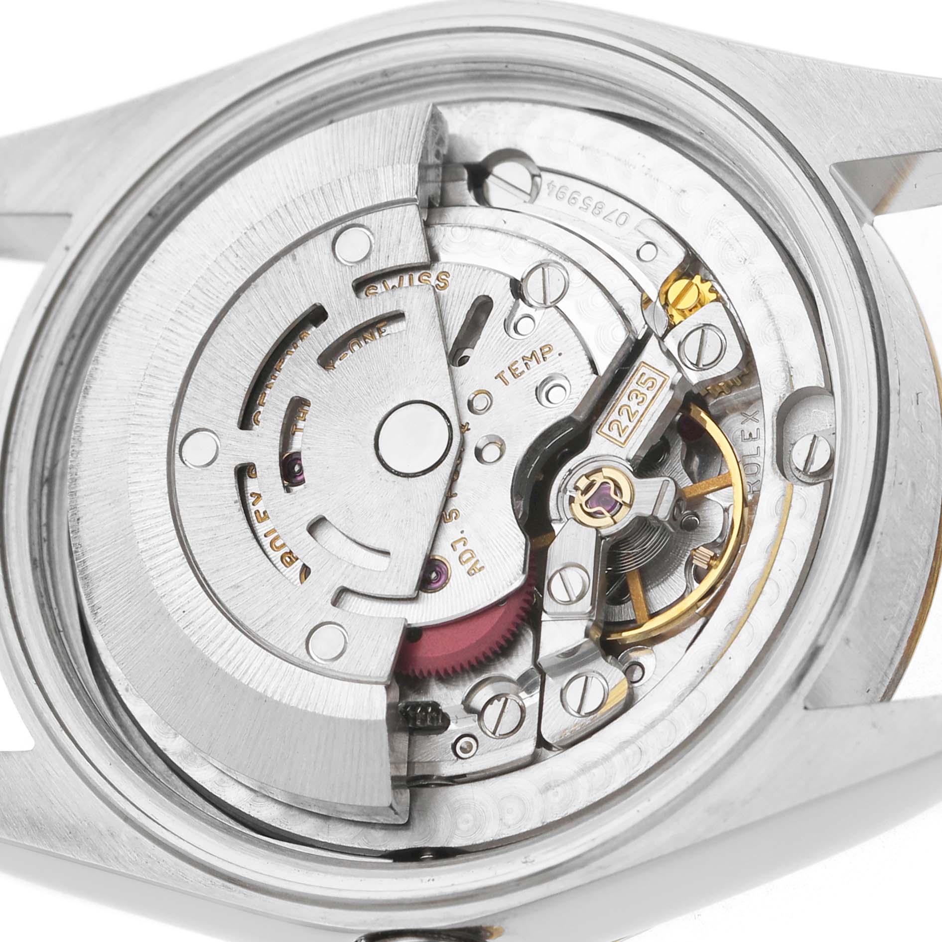 The image shows the internal movement of a Rolex Mid-Size 78273 Women's Steel and Gold (two tone) White Dial watch from a rear angle, highlighting the rotor and mechanical components.