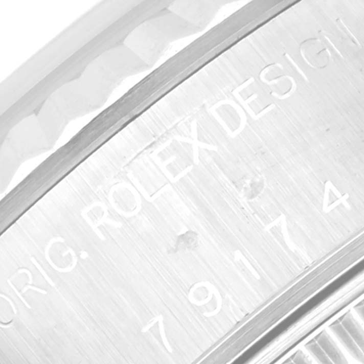 The image shows a close-up of the engraved side of the case for a Rolex Datejust 79174 Women's Stainless Steel Pink Dial 79174 Women's Stainless Steel Pink Dial model watch.