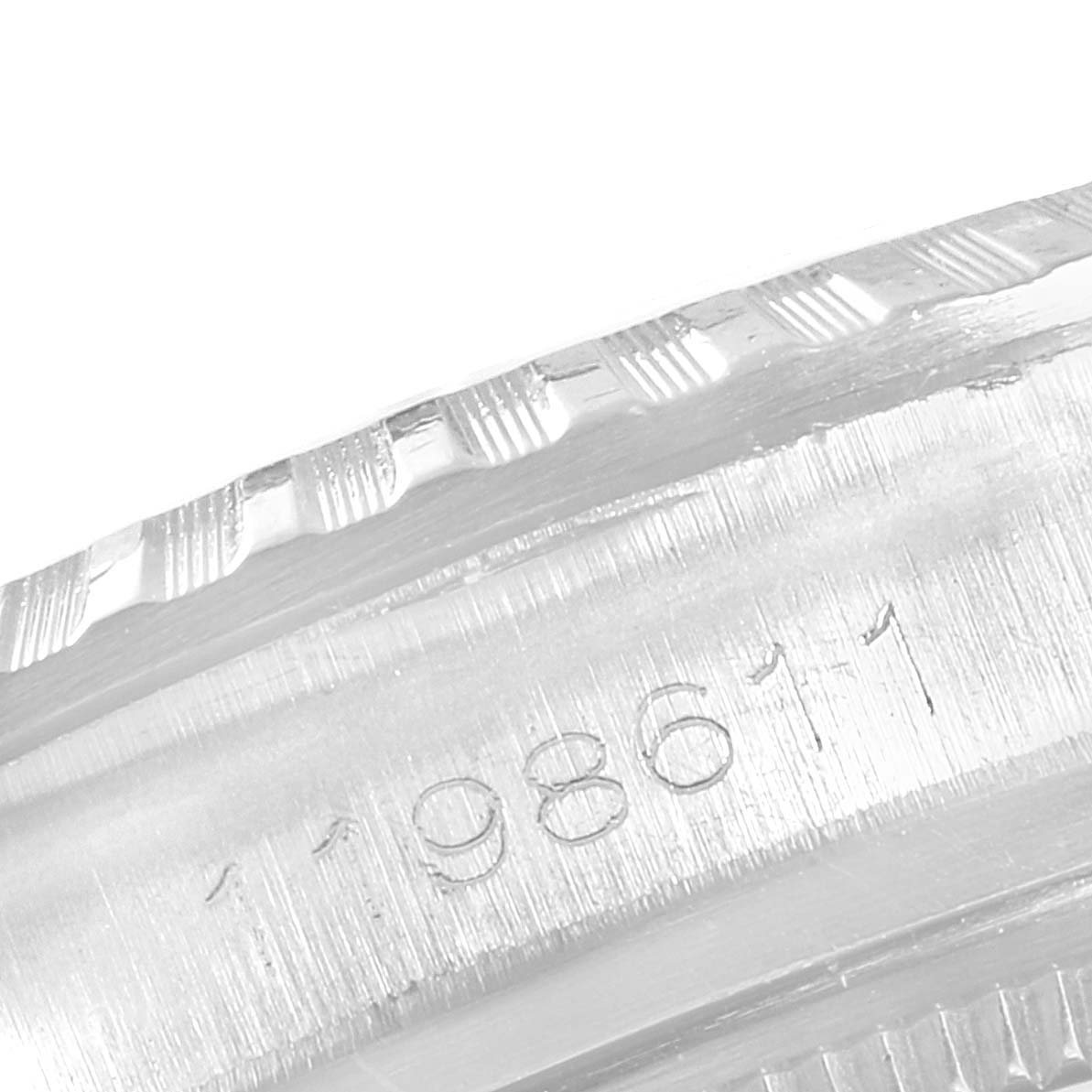 This image shows a close-up angle focusing on the serial number engraving on the case of a Rolex Vintage Collection 1603 Men
s Stainless Steel Silver Dial 1603 Men
s Stainless Steel Silver Dial model watch.