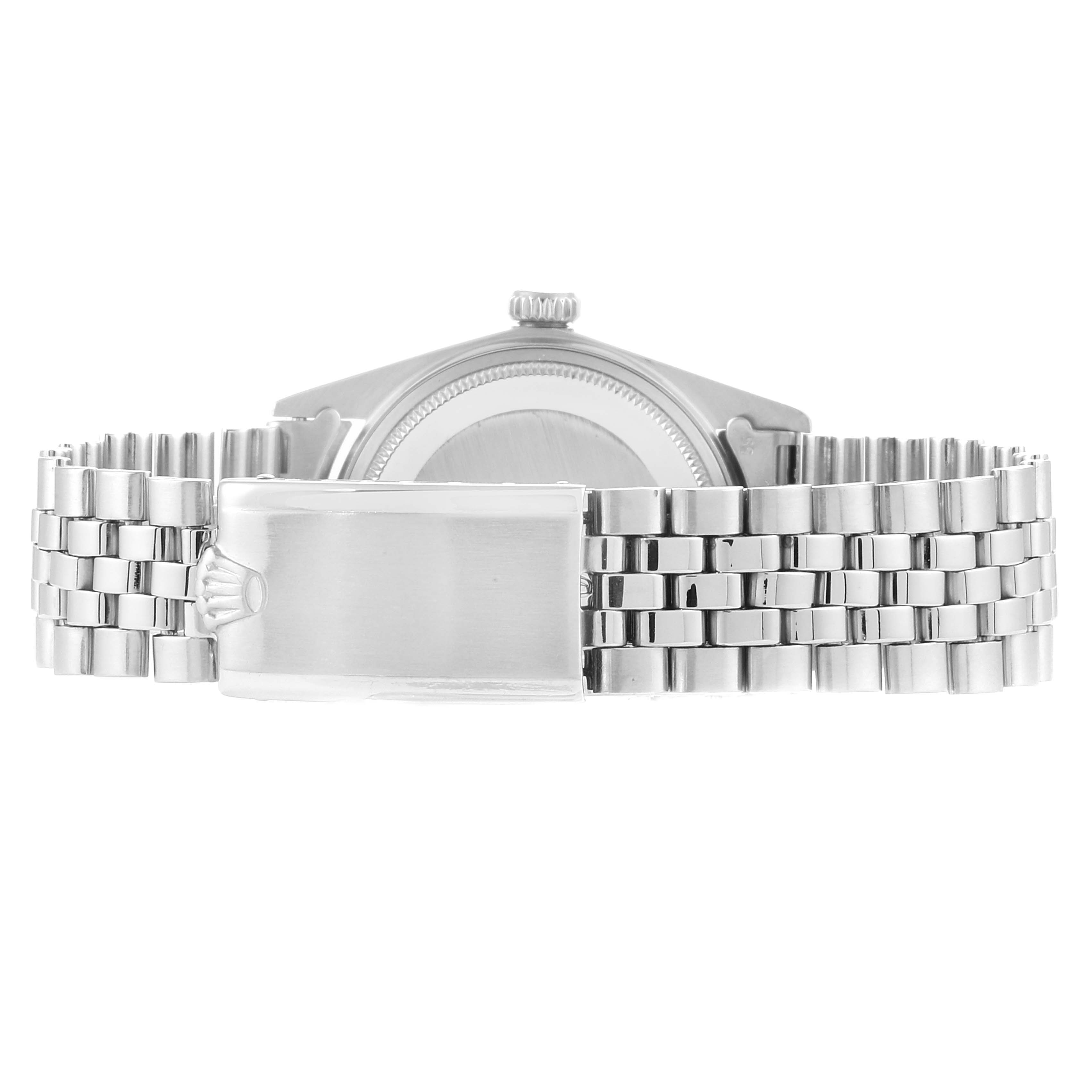 The image shows the back of the Rolex Vintage Collection 1603 Men
s Stainless Steel Silver Dial 1603 Men
s Stainless Steel Silver Dial watch, highlighting its clasp and metal bracelet.