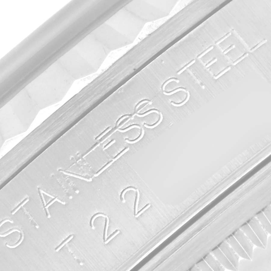 This close-up image shows the engraved stainless steel marking on the bezel of a Rolex Datejust 16234G Men's Stainless Steel Mother of Pearl Dial 16234G Men's Stainless Steel Mother of Pearl Dial watch.