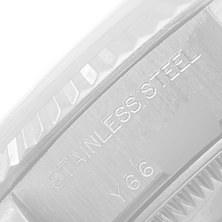 This image shows a close-up of the side of a Rolex Datejust 79174 Women's Stainless Steel White Dial 79174 Women's Stainless Steel White Dial watch case, highlighting the "STAINLESS STEEL" text.