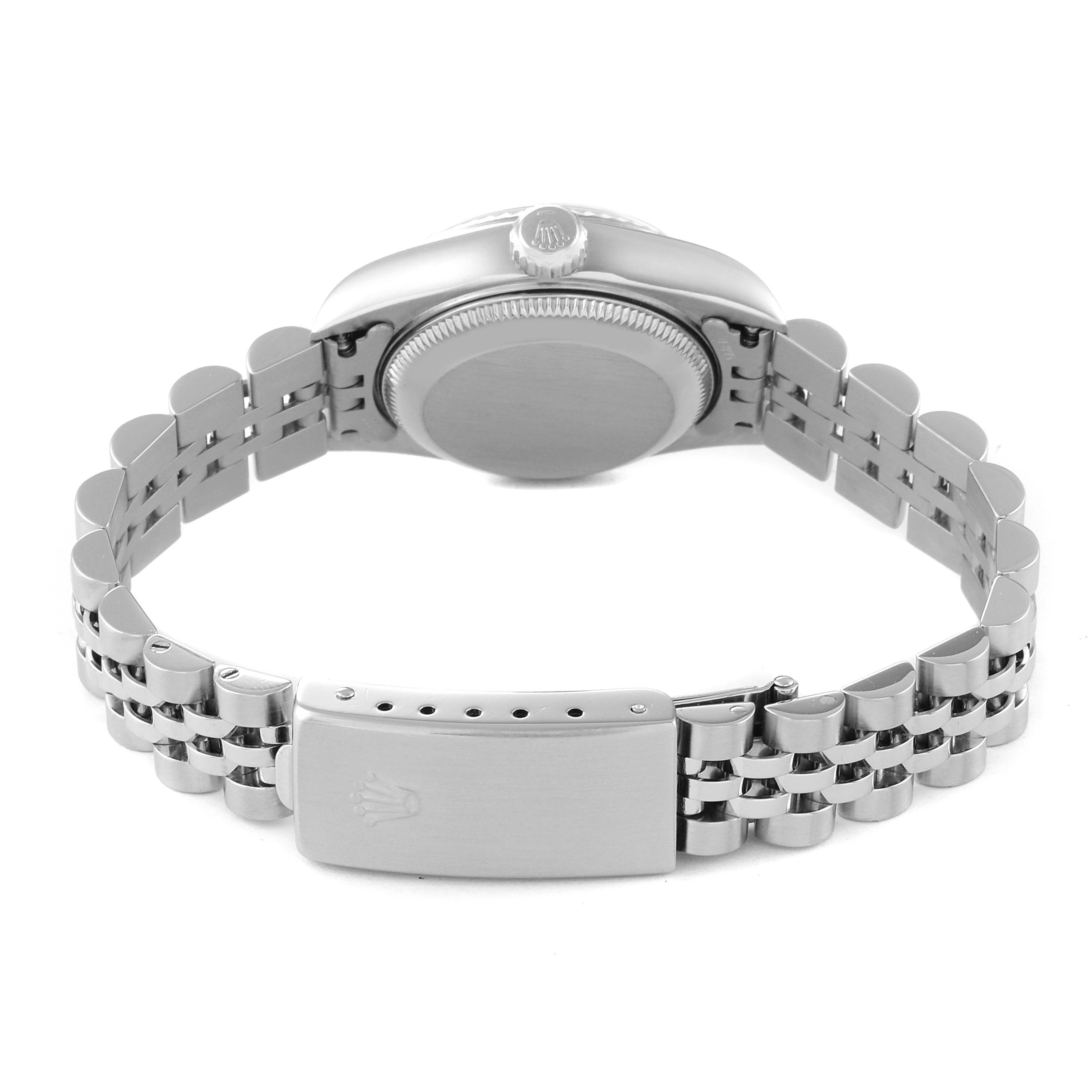 The image shows the back view of a Rolex Datejust 79174 Women's Stainless Steel White Dial 79174 Women's Stainless Steel White Dial watch, highlighting the case back, bracelet, and clasp.