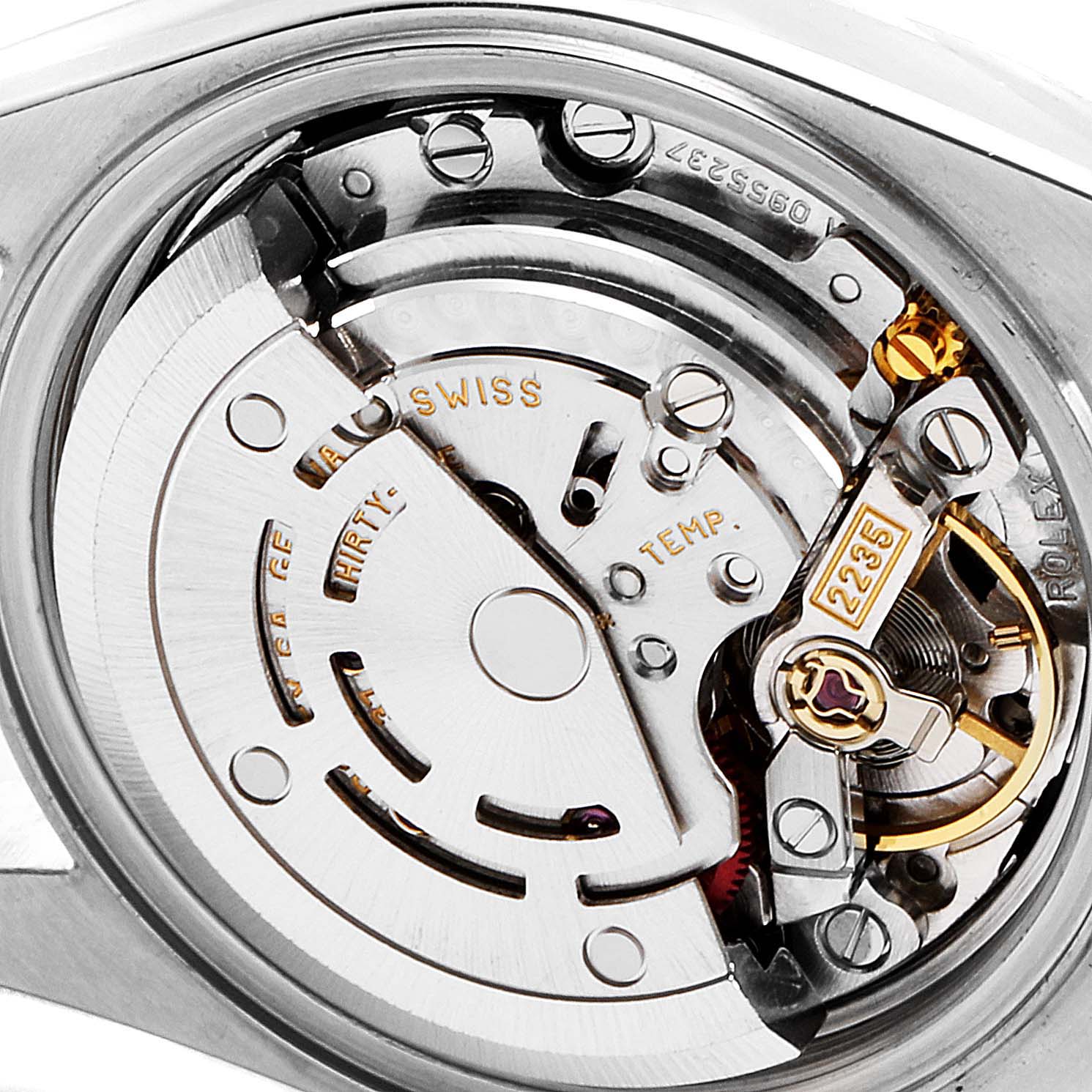 This is an internal view of the Rolex Datejust 79173 Women's Steel and Gold (two tone) Black Dial 79173 Women's Steel and Gold (two tone) Black Dial, showcasing its intricate mechanical movement components.