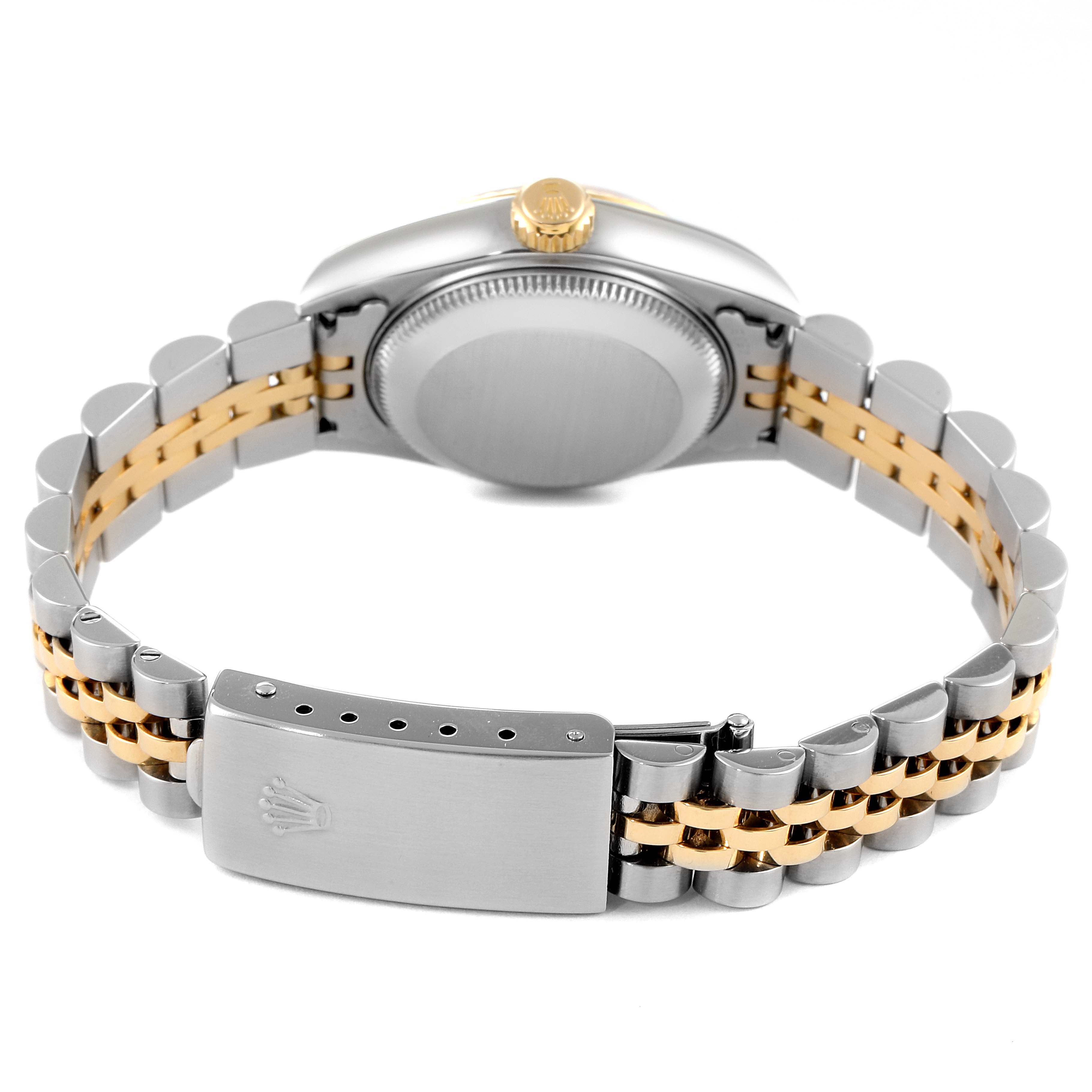 This image shows the back view of a Rolex Datejust 79173 Women's Steel and Gold (two tone) Black Dial 79173 Women's Steel and Gold (two tone) Black Dial watch with its clasp, bracelet, and caseback visible.