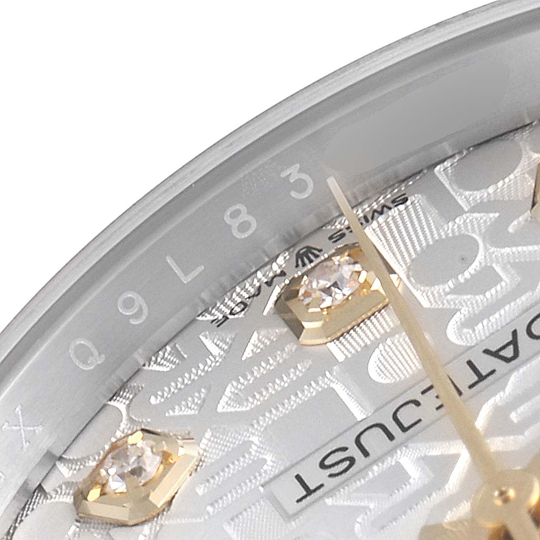The image shows a close-up angle of the bezel and dial of a Rolex Datejust 126233 Men's Steel and Gold (two tone) Silver Dial 126233 Men's Steel and Gold (two tone) Silver Dial watch, revealing diamond hour markers and the "DATEJUST" text.