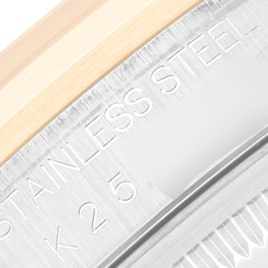 This image shows a close-up of the bezel and case back engraving on a Rolex Datejust 16203 Men's Steel and Gold (two tone) Grey Dial 16203 Men's Steel and Gold (two tone) Grey Dial watch.