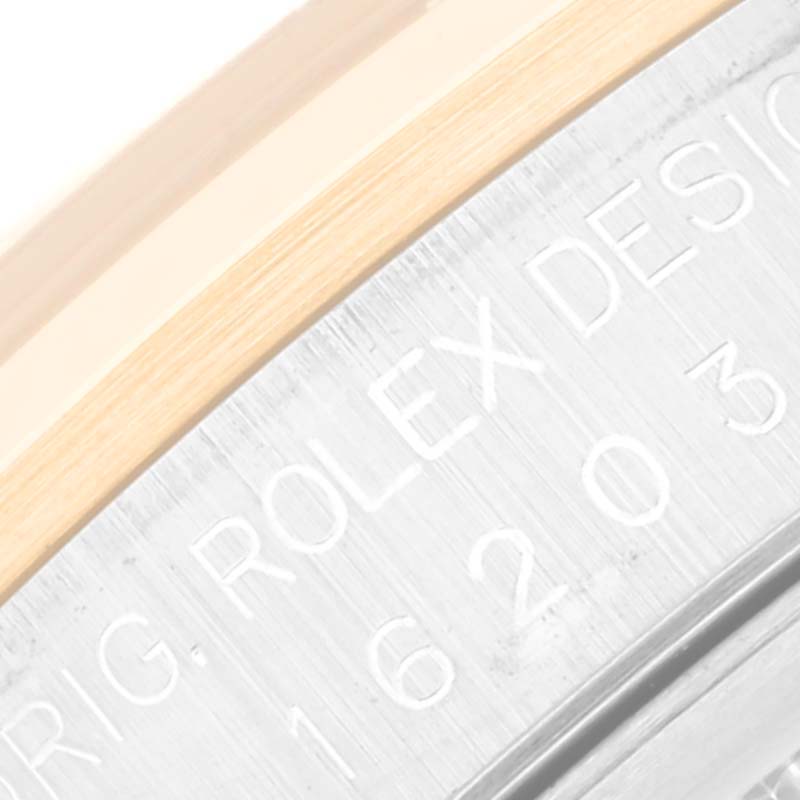 The image shows a close-up of the Rolex Datejust 16203 Men's Steel and Gold (two tone) Grey Dial 16203 Men's Steel and Gold (two tone) Grey Dial model's bezel and engraved case side.