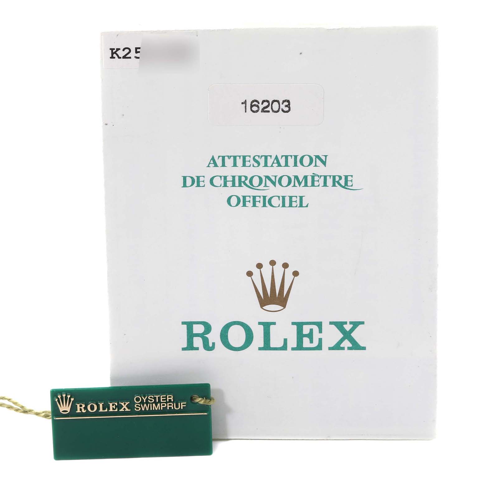This image shows the official chronometer certification and a green tag for the Rolex Datejust 16203 Men's Steel and Gold (two tone) Grey Dial 16203 Men's Steel and Gold (two tone) Grey Dial model.