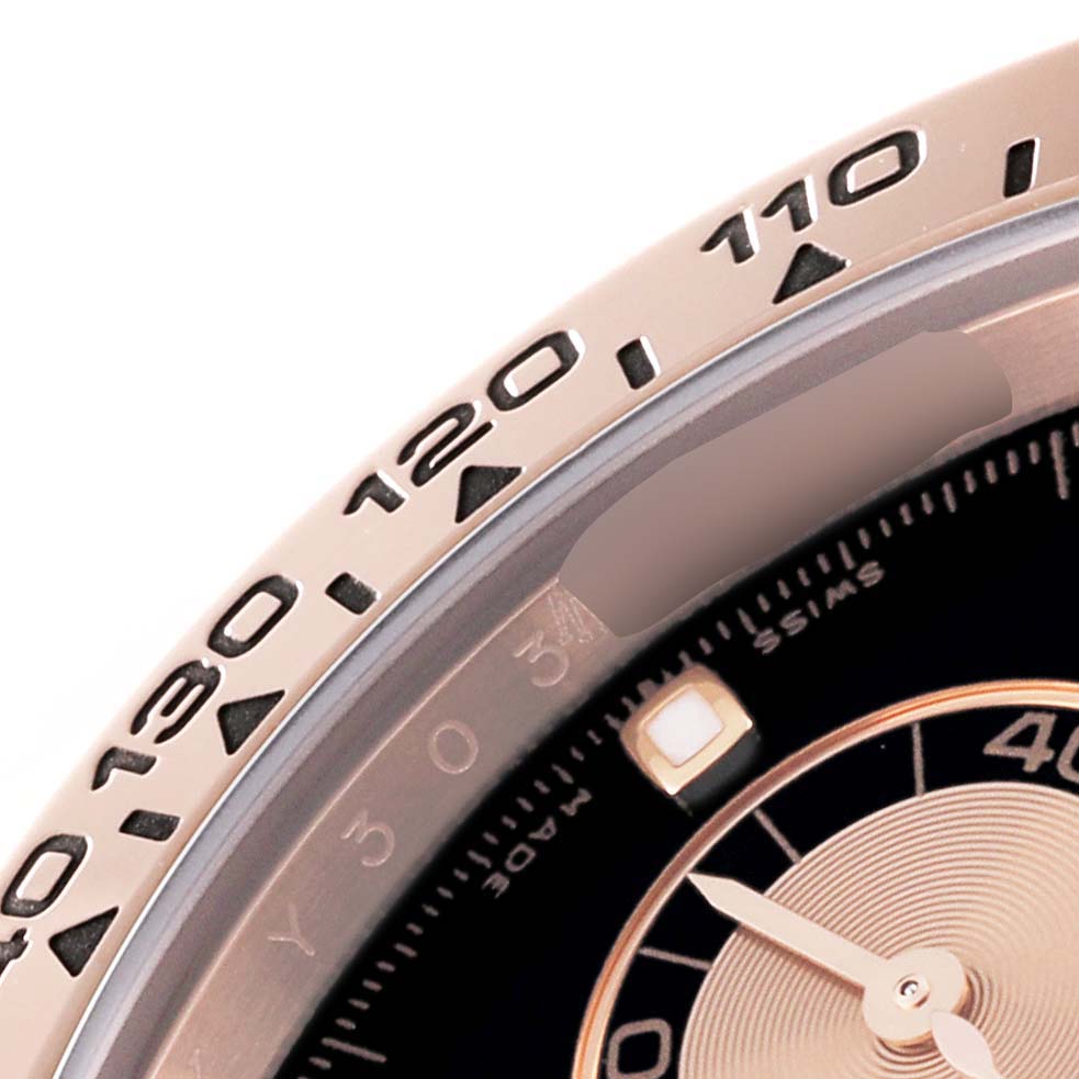 This close-up shows the bezel and part of the dial of the Rolex Daytona 116505 Men's Rose Gold Black Dial 116505 Men's Rose Gold Black Dial watch, highlighting the tachymeter scale and hour markers.