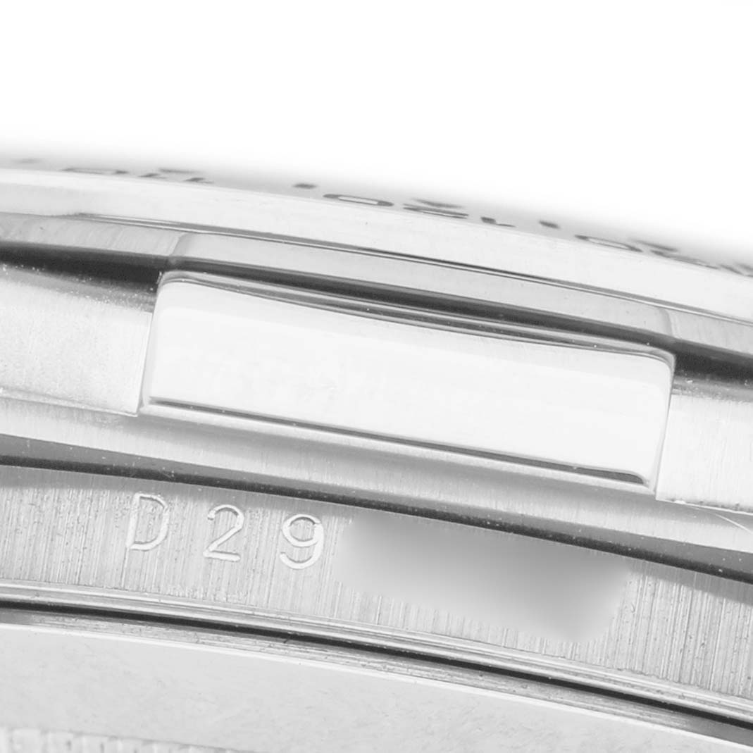 The image shows a close-up of the serial number side on the case edge of a Rolex Daytona 116519 Men's White Gold Silver Dial watch.