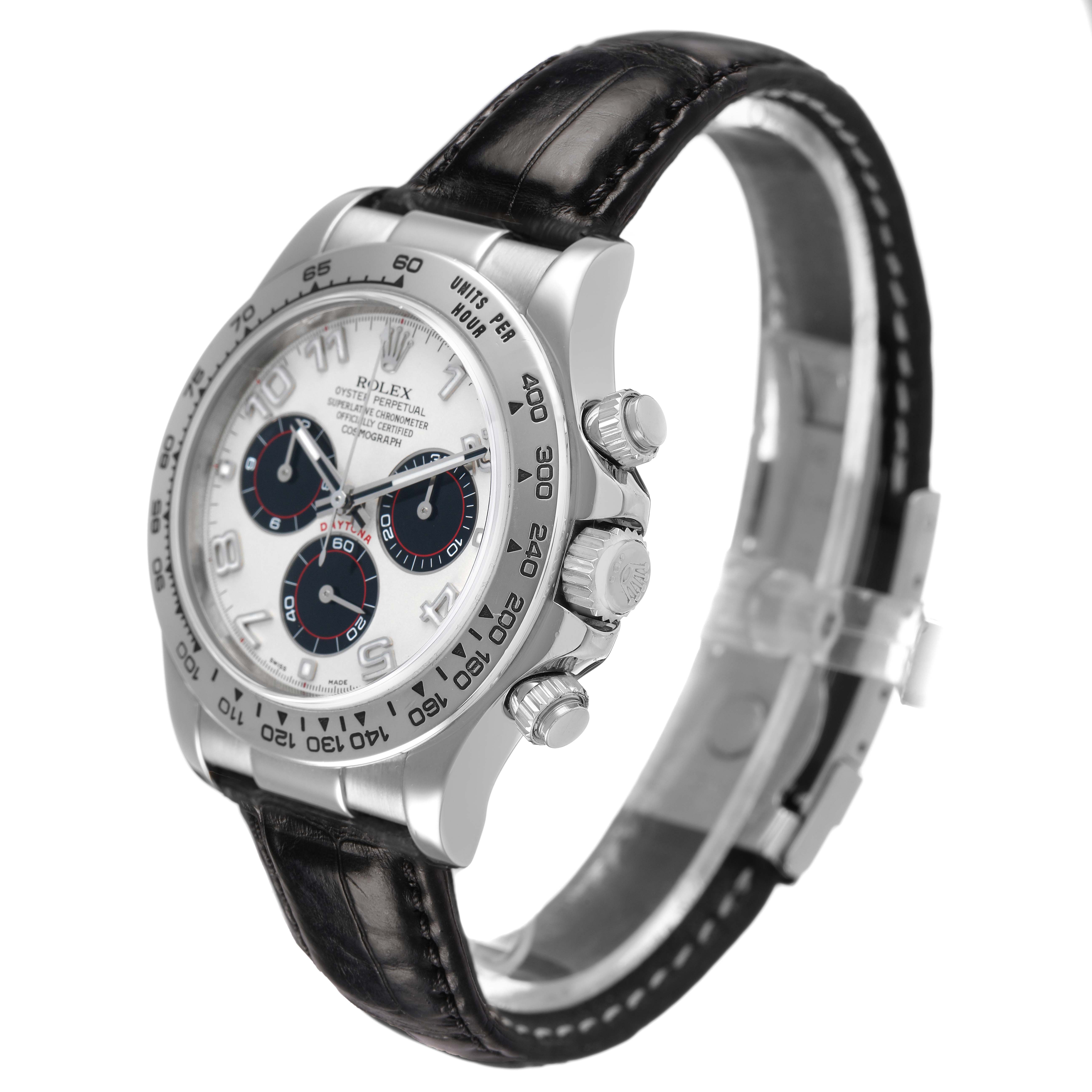 The Rolex Daytona 116519 Men's White Gold Silver Dial watch is shown at an angled side view, highlighting the bezel, dial, subdials, and leather strap.
