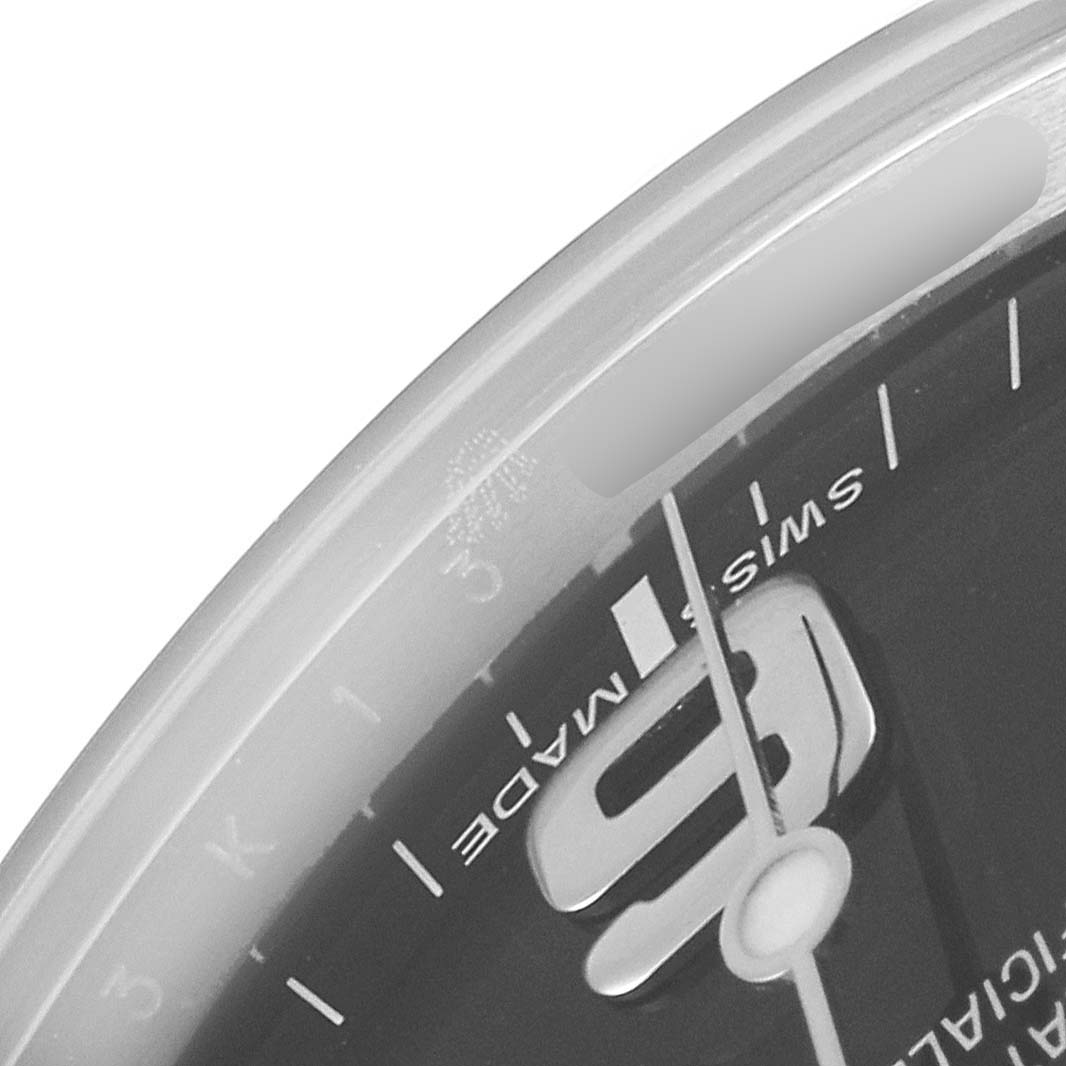 This image shows a close-up of the Explorer model by Rolex, specifically the edge of the dial with the number "3" visible.