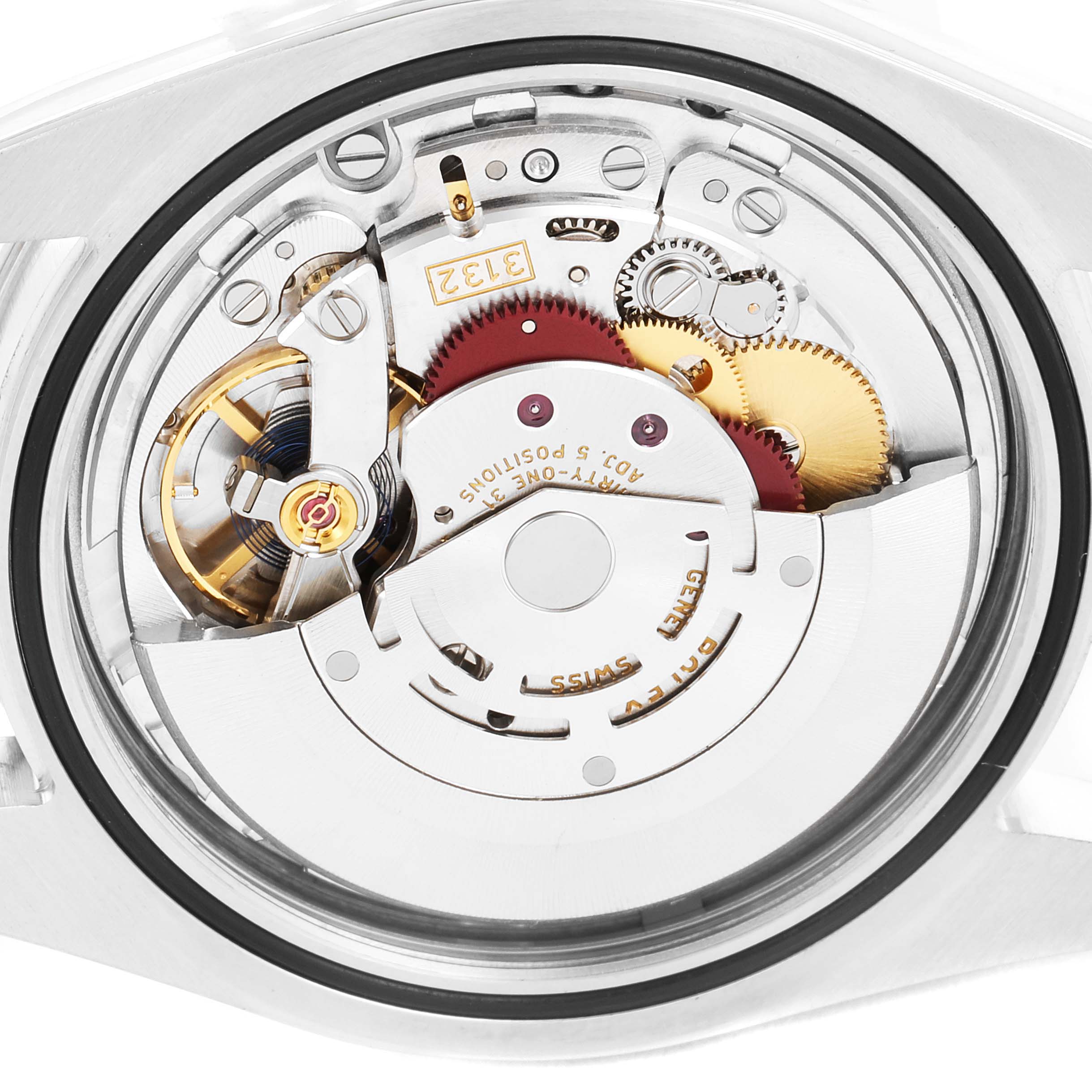 This is a close-up view of the inner mechanical movement of a Rolex Explorer 214270 Men
s Stainless Steel Black Dial 214270 Men
s Stainless Steel Black Dial watch, showing gears and other components.