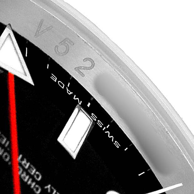The image shows a close-up of the dial and bezel edge of a Rolex Explorer 16570 T Men's Stainless Steel Black Dial watch, highlighting the markers and part of the bezel.