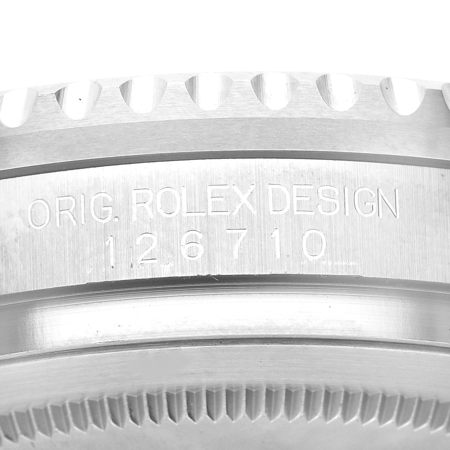 This image shows a close-up of the outer edge and design engraving on the casing of a Rolex GMT-Master 126710BLNR Men
s Stainless Steel Black Dial 126710BLNR Men
s Stainless Steel Black Dial model.