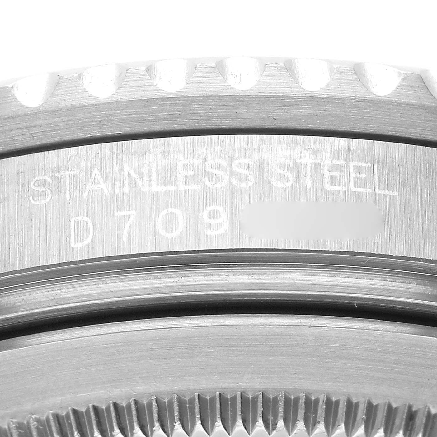 This close-up angle shows the stainless steel case back and part of the bezel of a Rolex GMT-Master 16710 Men's Stainless Steel Black Dial 16710 Men's Stainless Steel Black Dial watch.