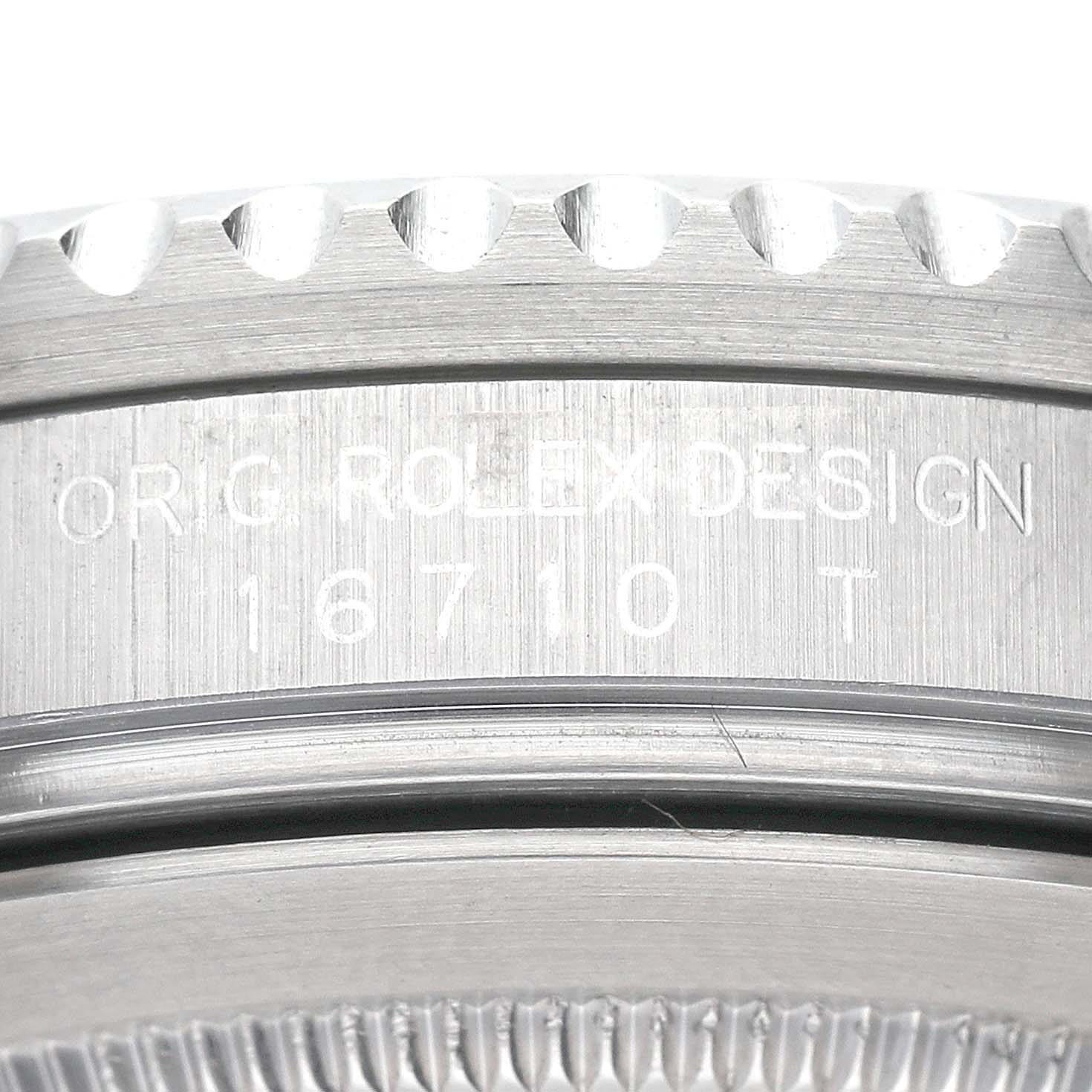 This close-up shot shows the engraved model number "16710T" and part of the bezel of a Rolex GMT-Master 16710 Men's Stainless Steel Black Dial 16710 Men's Stainless Steel Black Dial watch.