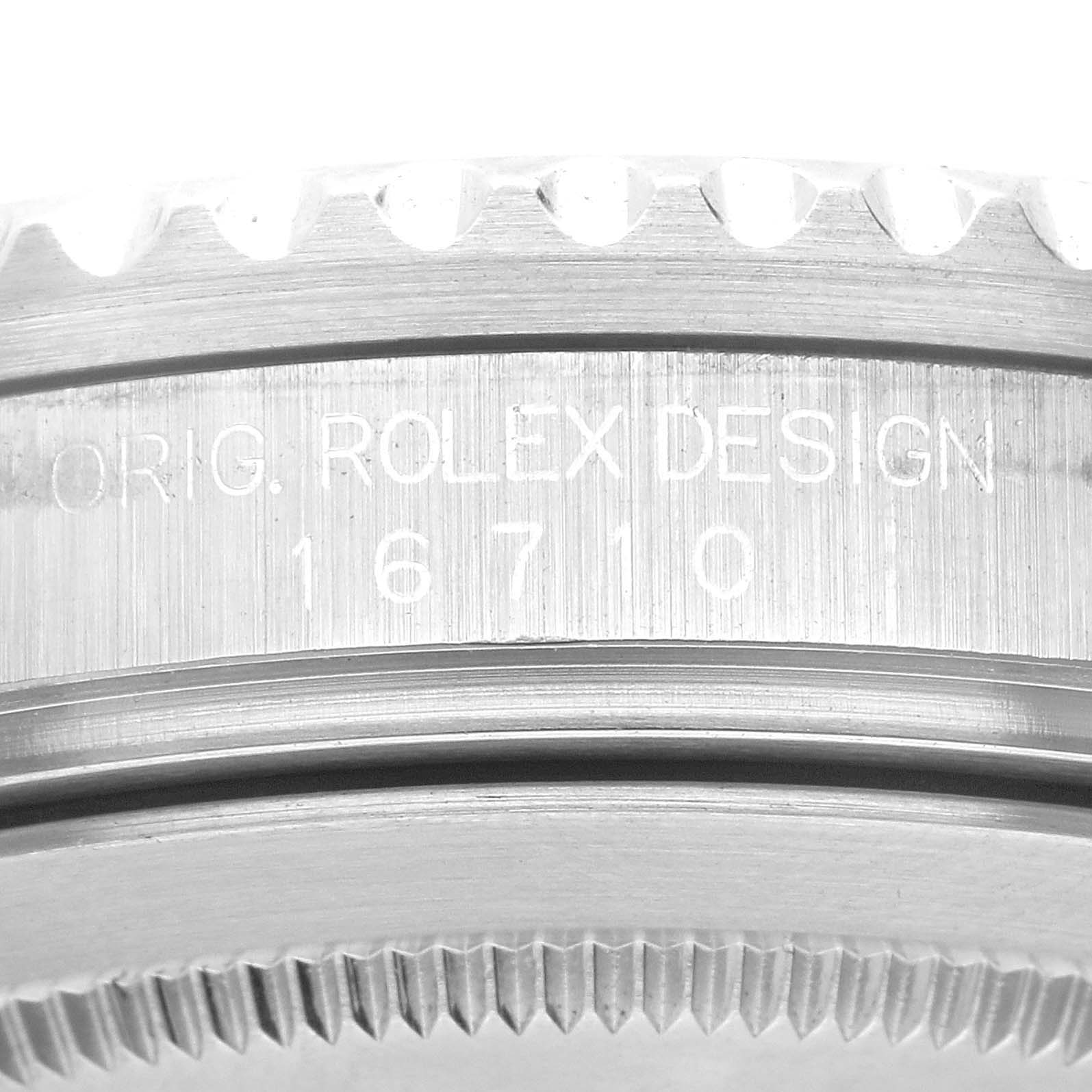 The image shows a close-up view of the side engraving and bezel teeth of a Rolex GMT-Master 16710 Men
s Stainless Steel Black Dial 16710 Men
s Stainless Steel Black Dial model watch.