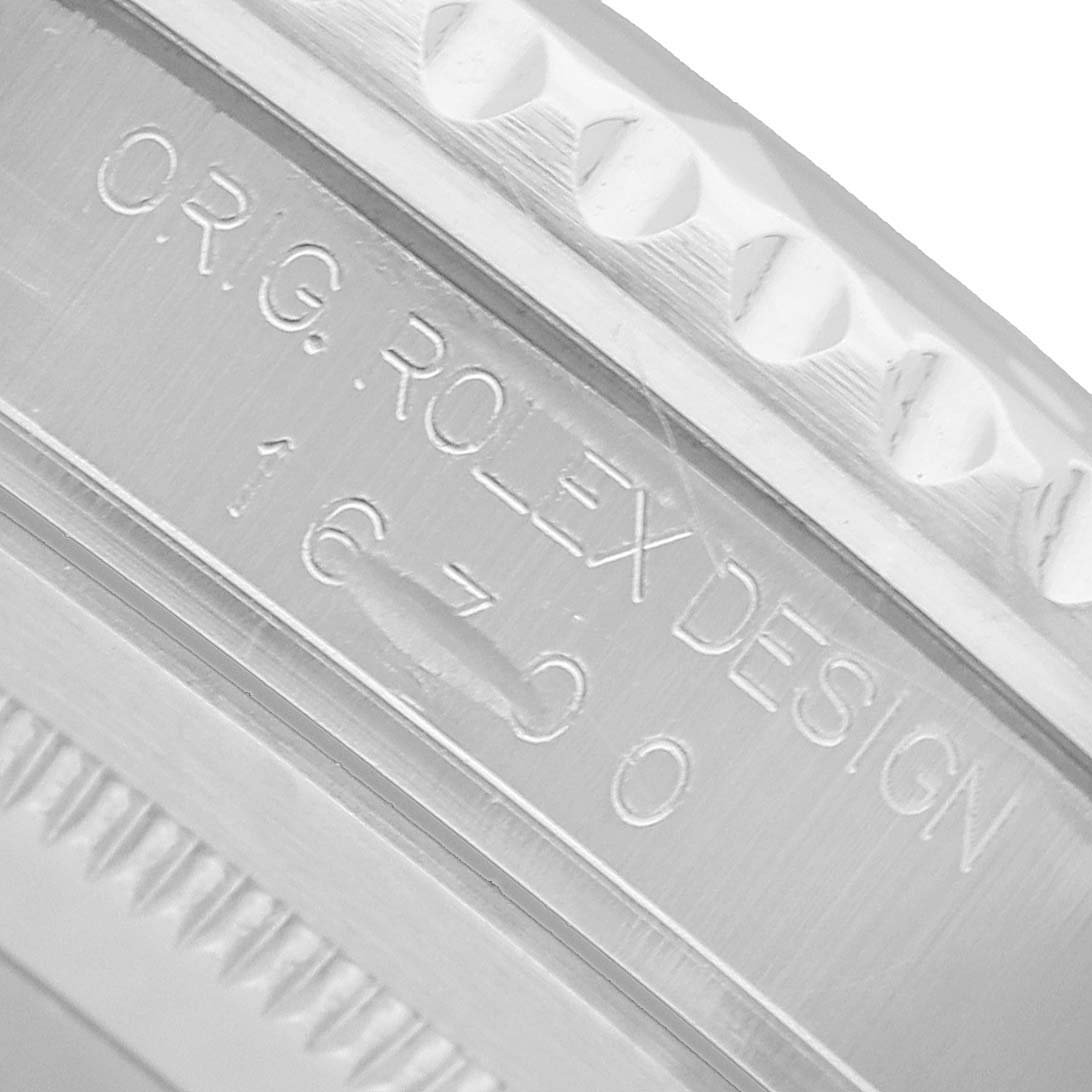 The image shows a close-up angle of the case side of a Rolex GMT-Master 16700 Men's Stainless Steel Black Dial, highlighting the engraved model number and design information.