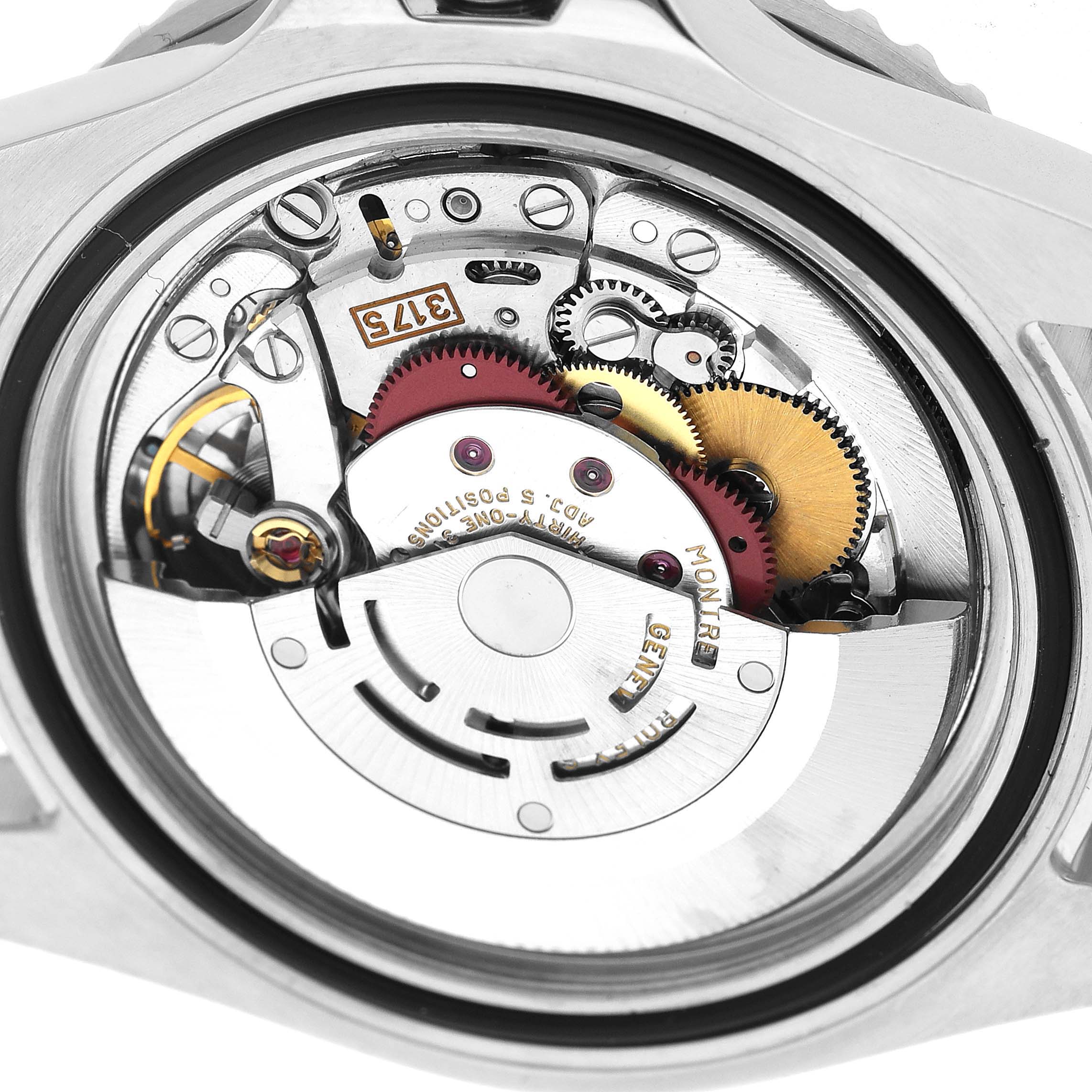 The image shows the back view of a Rolex GMT-Master 16700 Men's Stainless Steel Black Dial watch, revealing its inner movement components.