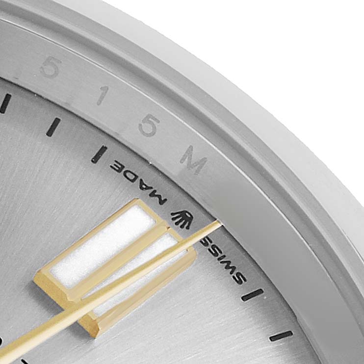 The image shows a close-up of the dial and hands of a Rolex Oyster Perpetual 124300 Men's Stainless Steel Silver Dial, highlighting the minute track and "Swiss Made" text.