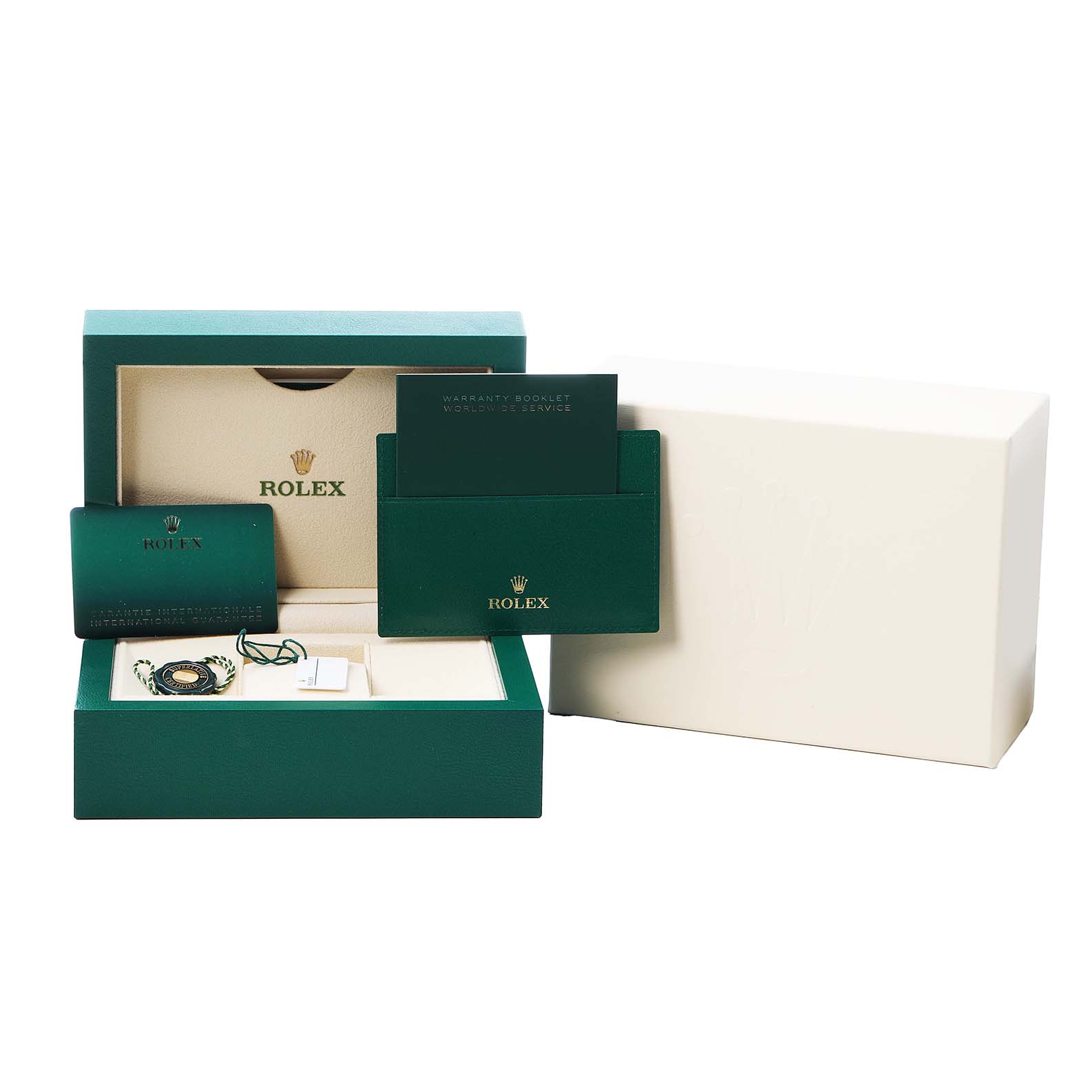 The image shows the packaging and accessories for a Rolex Oyster Perpetual 124300 Men's Stainless Steel Silver Dial, including the box, warranty booklet, and tags.