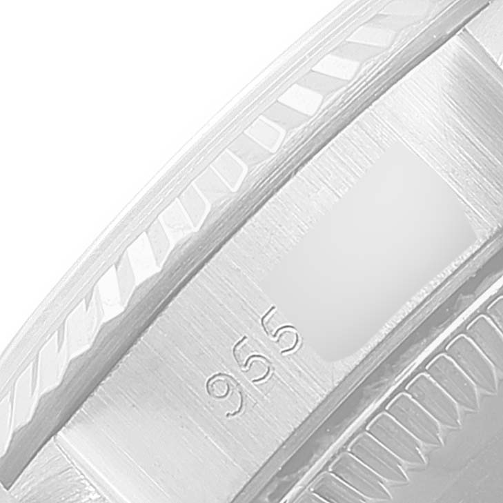 This image shows a close-up angle of the bezel and part of the band of a Rolex Oyster Perpetual 67194 Women
s Stainless Steel Silver Dial 67194 Women
s Stainless Steel Silver Dial watch.