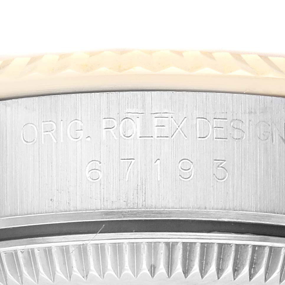 The image shows a close-up of the case back and edge of an Oyster Perpetual Rolex watch, revealing the model number "67193".