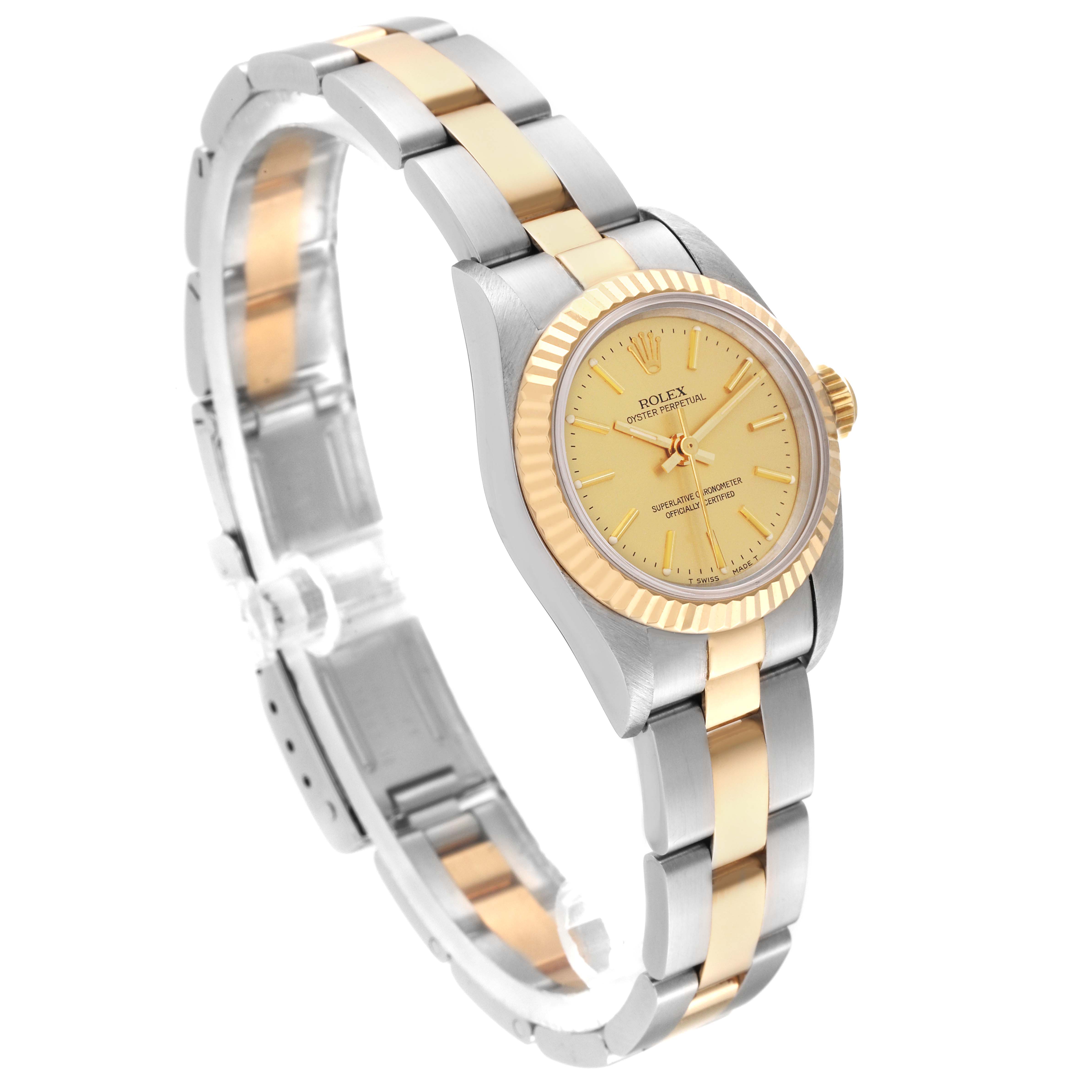 The Rolex Oyster Perpetual 67193 Women's Steel and Gold (two tone) Champagne Dial 67193 Women's Steel and Gold (two tone) Champagne Dial watch is shown from a three-quarter angle, displaying the face, bezel, crown, and bracelet.