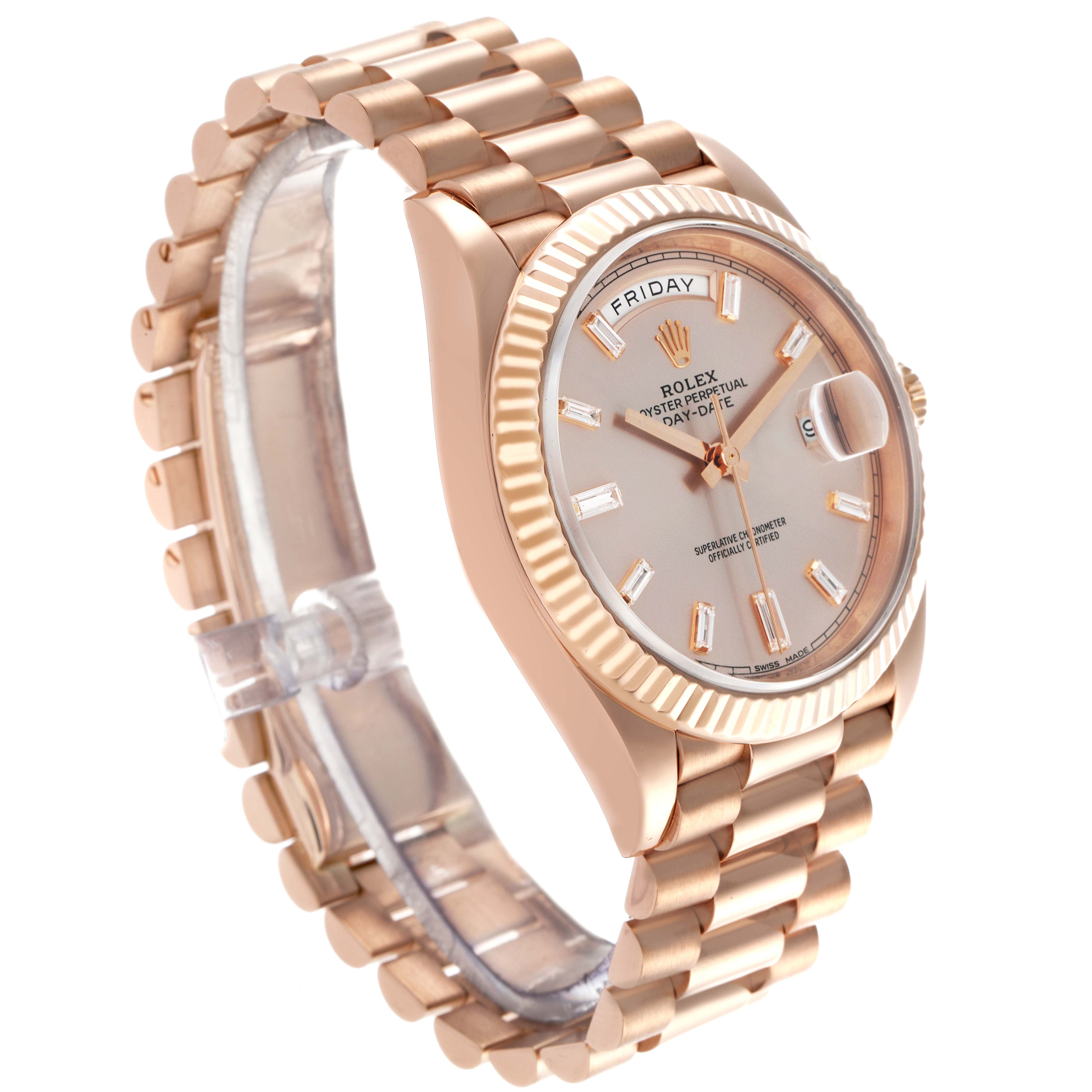 The Rolex President 228235 Men's Rose Gold Pink Dial 228235 Men's Rose Gold Pink Dial model watch is shown at a slight angle, highlighting its bracelet, fluted bezel, and day-date display.