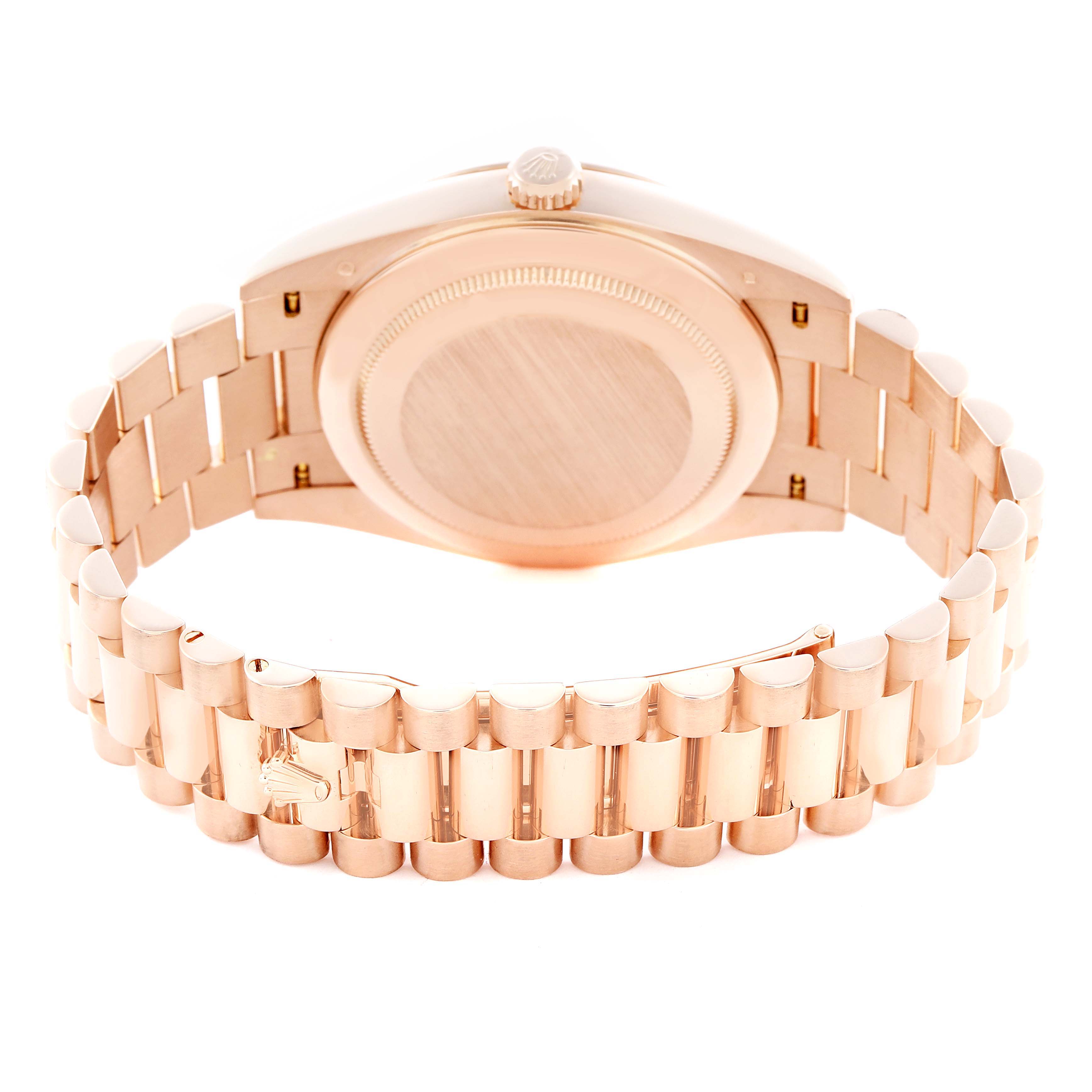 The image shows the back of the Rolex President 228235 Men's Rose Gold Pink Dial 228235 Men's Rose Gold Pink Dial model with its case, bracelet, and clasp visible from a rear angle.